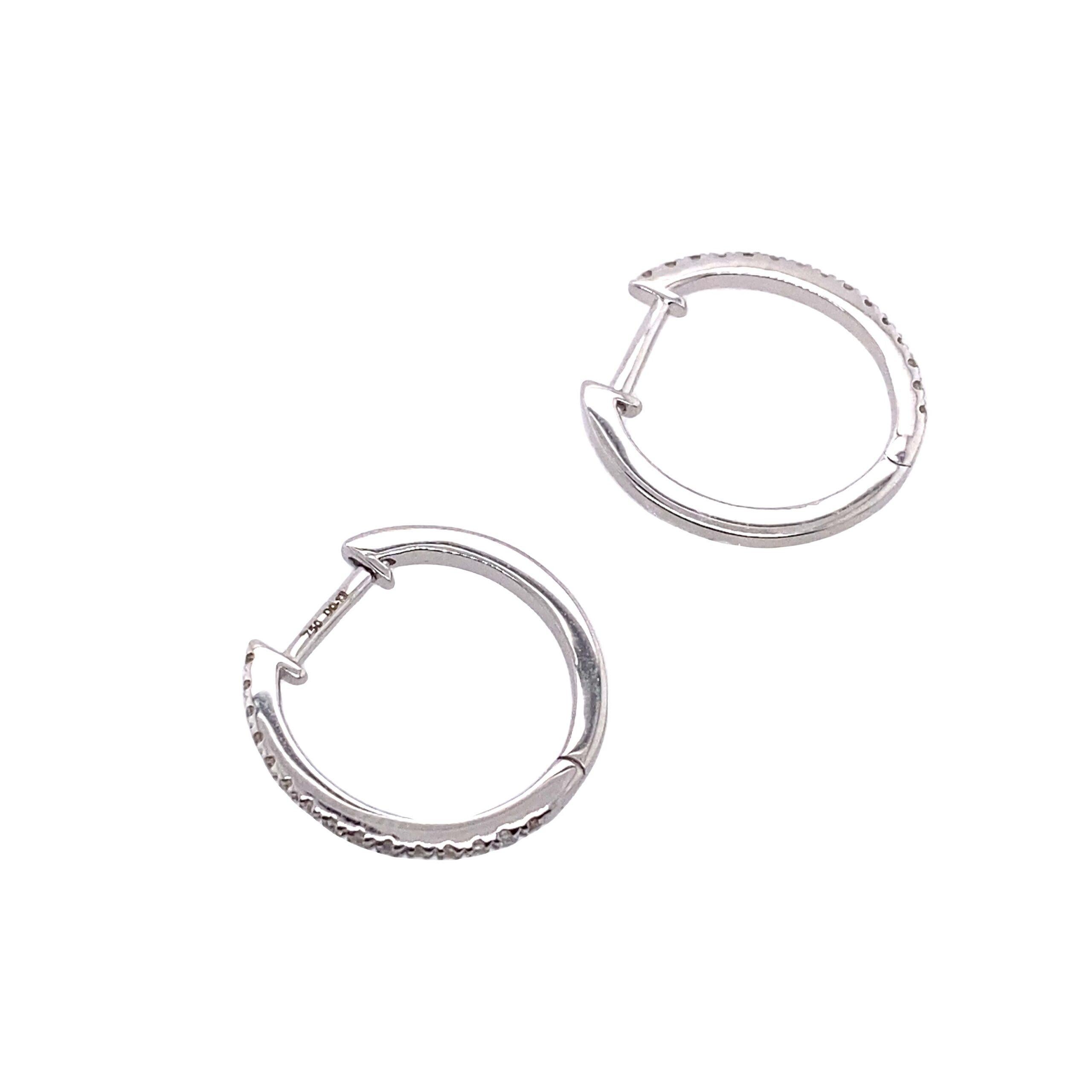 18ct White Gold Diamond Hoop Earrings, Set With 0.13ct Of Round Diamonds,15mm

The earrings measure 15mm in diameter and are set with 0.13ct of round diamonds. The earrings are a great choice for women who love to wear jewellery that is both classy