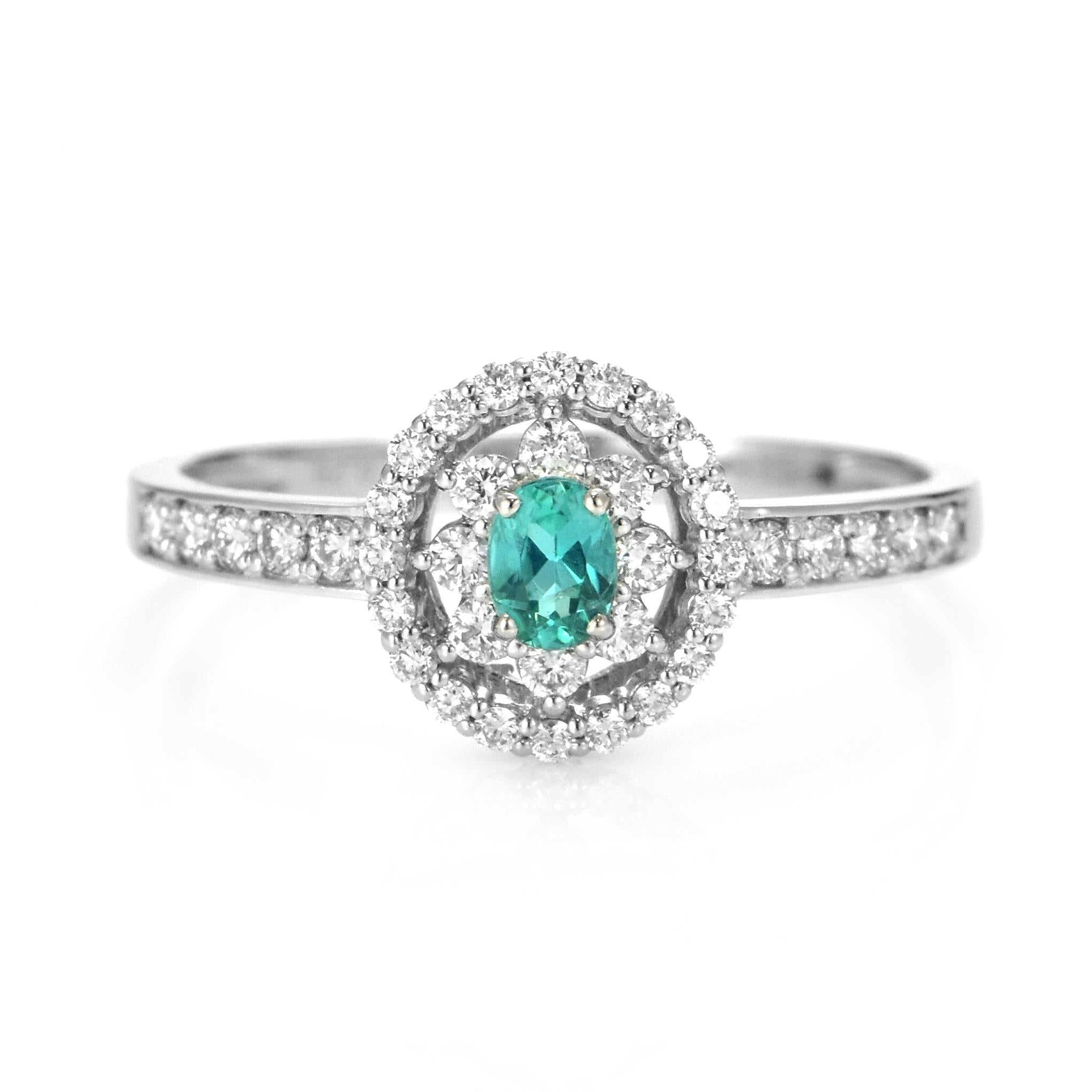 A beautiful ring featuring 0.14 Carats Natural Paraiba Tourmaline and 0.29 Carats of Diamond Accents made in Platinum. Paraiba Tourmalines were only discovered 30 years ago in the Brazilian state of the same name- Paraiba. Since then they have