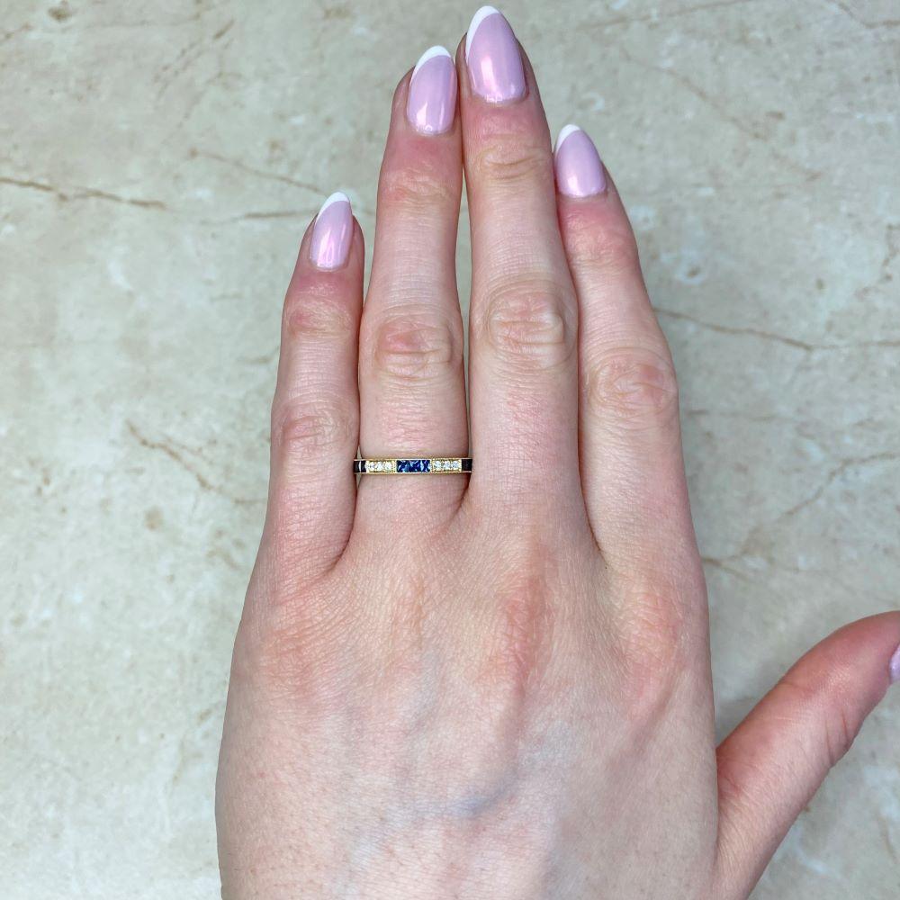 Exuding timeless elegance, this exquisite half-eternity wedding band is crafted in rich 18k yellow gold and showcases a distinctive design that blends classic artistry with refined sophistication. The band features a striking three-by-three pattern,