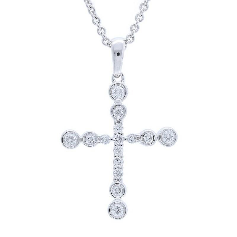 Diamond Carat Weight: This elegant cross pendant showcases a total of 0.15 carats of diamonds, which consist of 15 round brilliant-cut diamonds. These diamonds are carefully selected for their brilliance and clarity, creating a radiant and