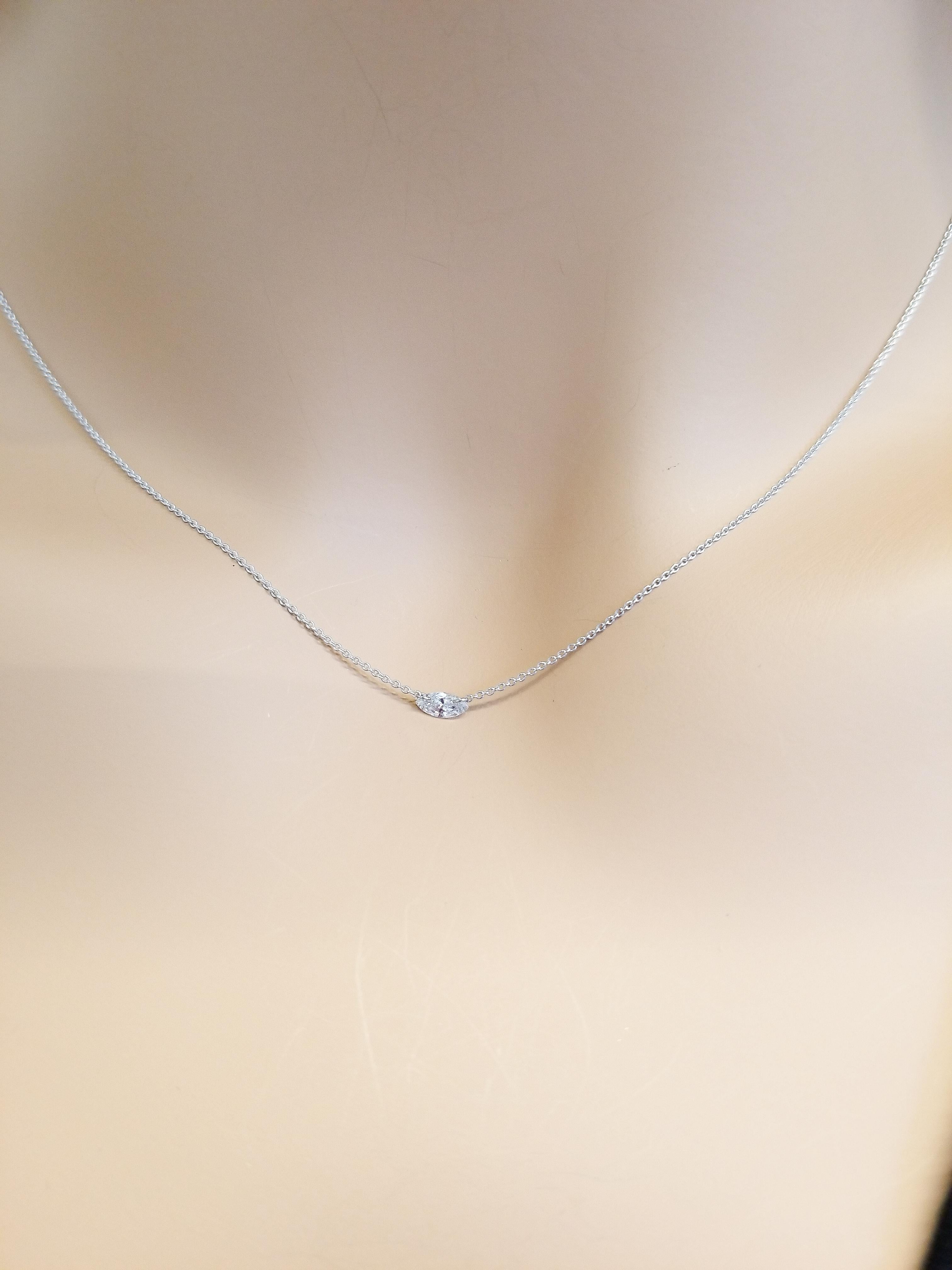 This single-station diamond necklace is stylish and versatile. One marquise cut diamond is drill-set onto jump rings on the top weighing 0.15 carats. It's quality is G color and SI1 clarity. This diamond is set onto a light cable link chain all in