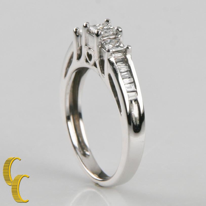 One electronically tested 14KT white gold ladies cast cathedral style, diamond unity ring with a bright finish
Condition is good.
One ladies 14KT white gold cathedral style diamond unity ring, size 3 3/4
Contains:
One prong set princess cut