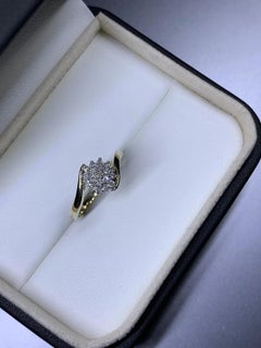 0.15ct Diamond twisted chunky solitaire engagement ring in 9ct yellow gold
