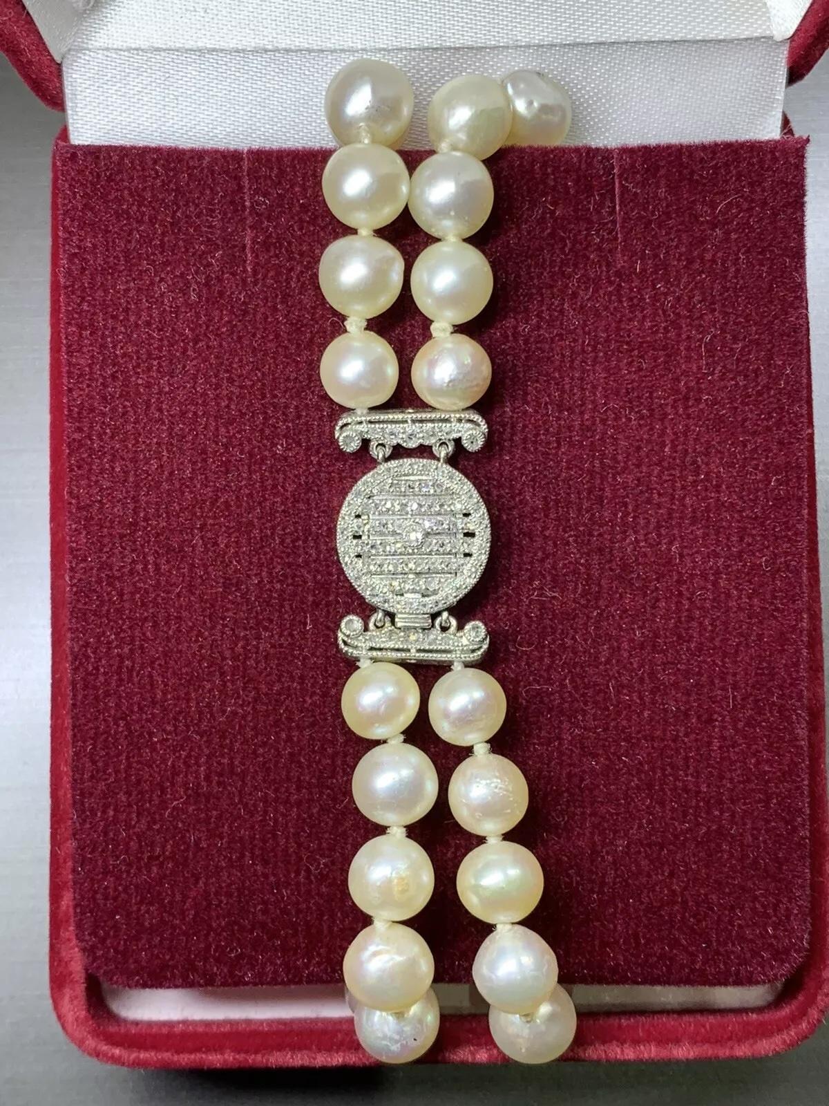 7mm Victorian Cultured Pearl Diamonds Double Row Bracelet Antique In Platinum.

Diamonds 0.15ct G colour VS2 clarity.

Chunky double row pearl bracelet antique with platinum clasp with diamonds.

Double strand antique pearl white colour and diamonds
