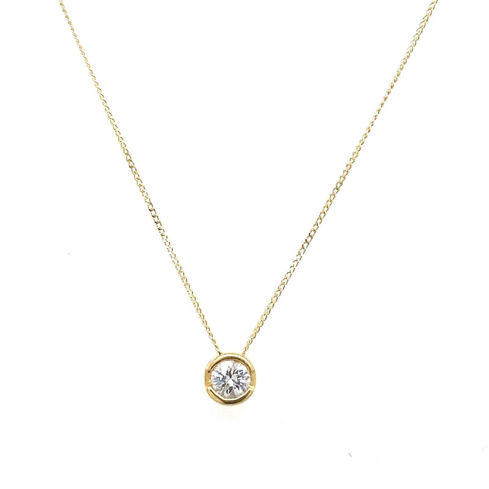 This necklace set features 1 natural round brilliant cut diamond with the total weight of 0.15ct. The diamond is set in 18ct yellow gold, and total length of the necklace is 16