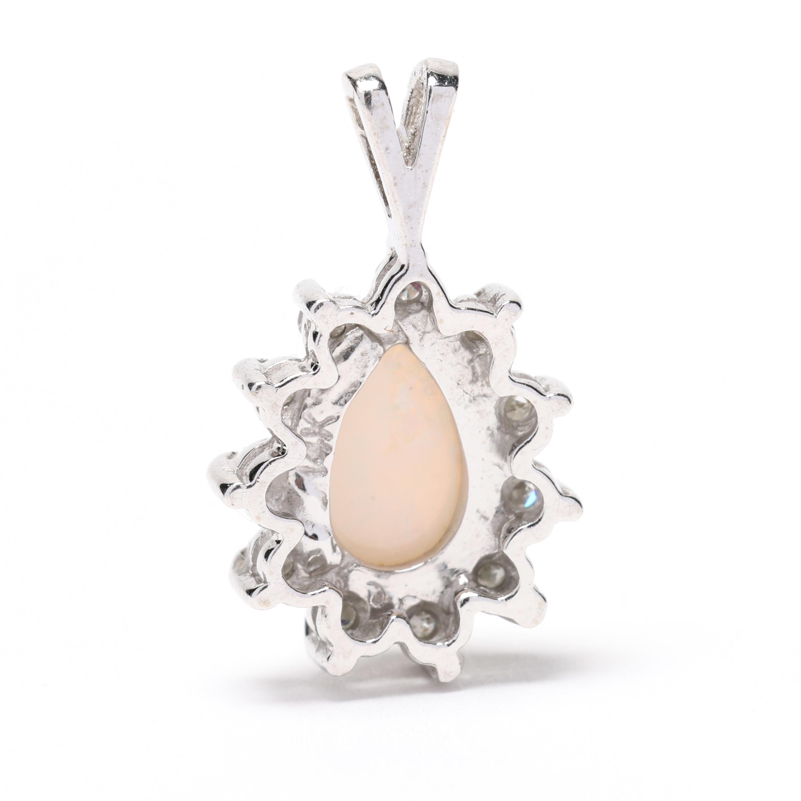Elevate your jewelry collection with this exquisite 0.15ctw Diamond and Opal Cluster Charm. Set in lustrous 14k white gold, this pear-shaped floral pendant boasts a mesmerizing blend of shimmering diamonds and iridescent opals.



Stones:

- opal, 1