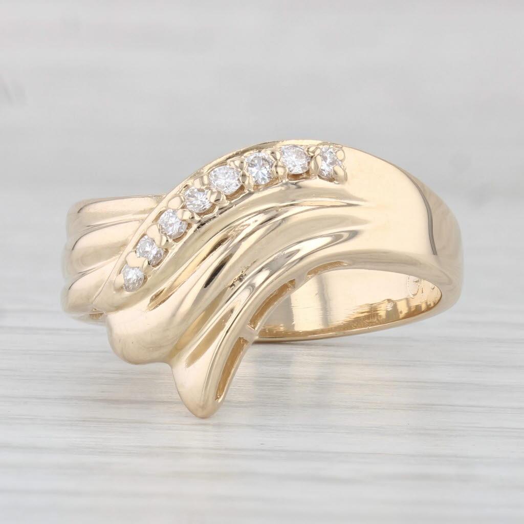 Gemstone Information:
- Natural Diamonds -
Total Carats - 0.15ctw
Cut - Round Brilliant
Color - H - I
Clarity - VS2 - SI1

Metal: 14k Yellow Gold 
Weight: 6.8 Grams 
Stamps: 14k
Face Height: 13.6 mm 
Rise Above Finger: 5.1 mm
Band / Shank Width: 3.9