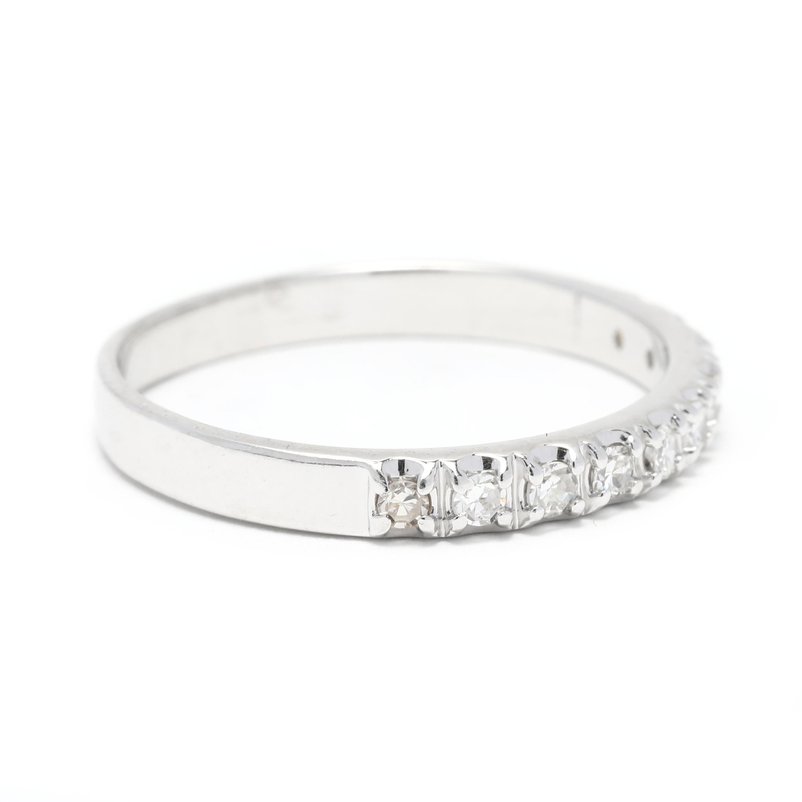 This elegant 0.15ctw diamond wedding band is the perfect way to add a touch of sparkle to your look. Made with 14K white gold, this timeless design features a row of French set diamonds for a traditional look. The thin band is stackable, making it