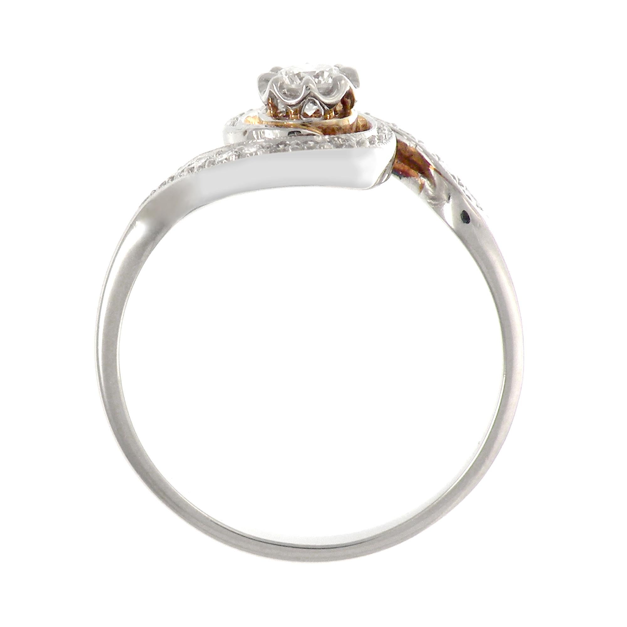 This striking platinum engagement ring Edwardian era inspired is set with a 0.17 ct center diamond. Small diamonds are grain set on the shoulders, weight 0.335 carat in total.

Ring size: 7