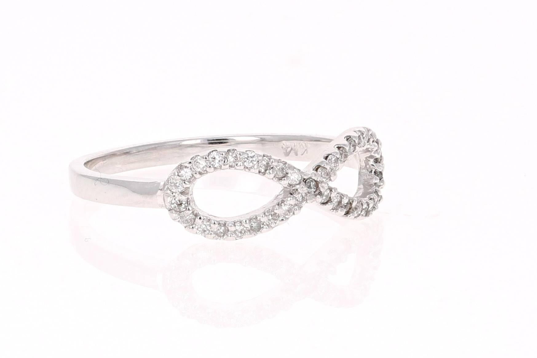 A cute and dainty infinity ring that is sure to be a great addition to your jewelry collection.

It has 37 Round Cut Diamonds that weigh a total of 0.17 carats.  It is made in 14K White Gold and weighs 1.7 grams.  

Complimentary ring sizing is