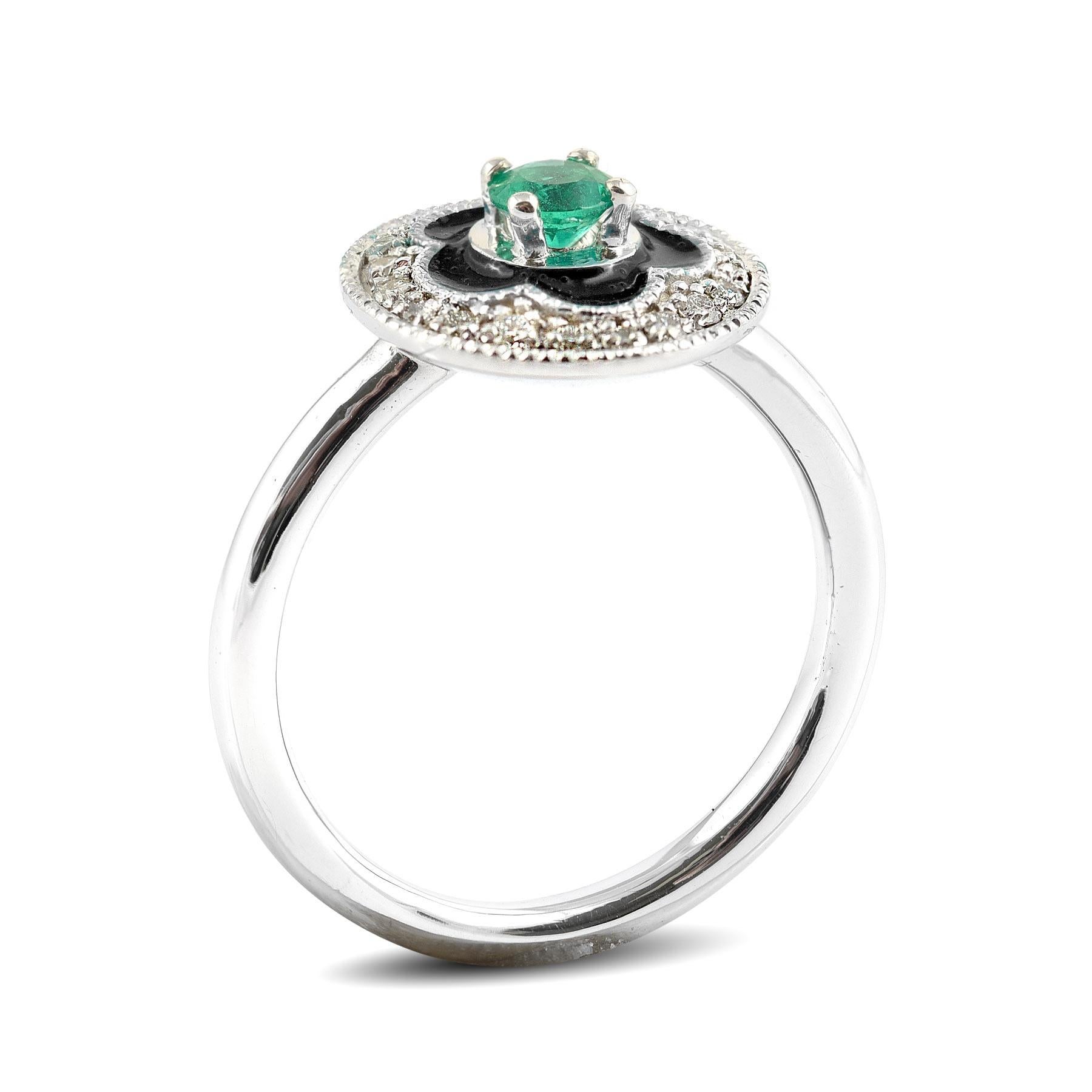 An unexpected choice, this 0.17 carat Emerald and enamel ring is a simple yet indulgent ring. Crafted in 14K white gold, this band also comes set with diamonds that add to its sparkle. A perfect choice when it comes to a gift, this ring will surely