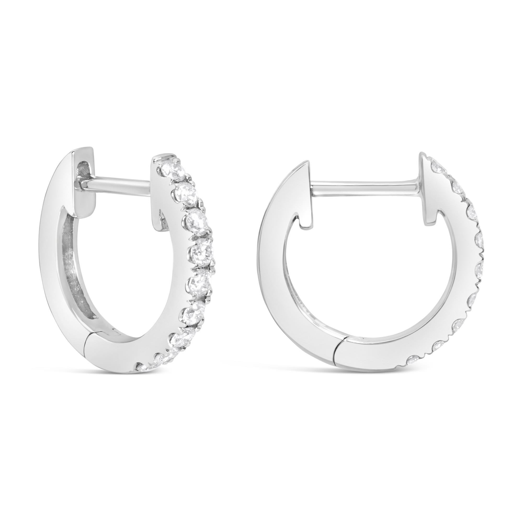 A wonderful pair of huggie earrings, featuring 18 round brilliant cut diamonds weighing 0.18 carat total. Each earring is 12 mm in length. Finely made with 18K white gold. Perfect for casual wear.

Roman Malakov is a custom house, specializing in