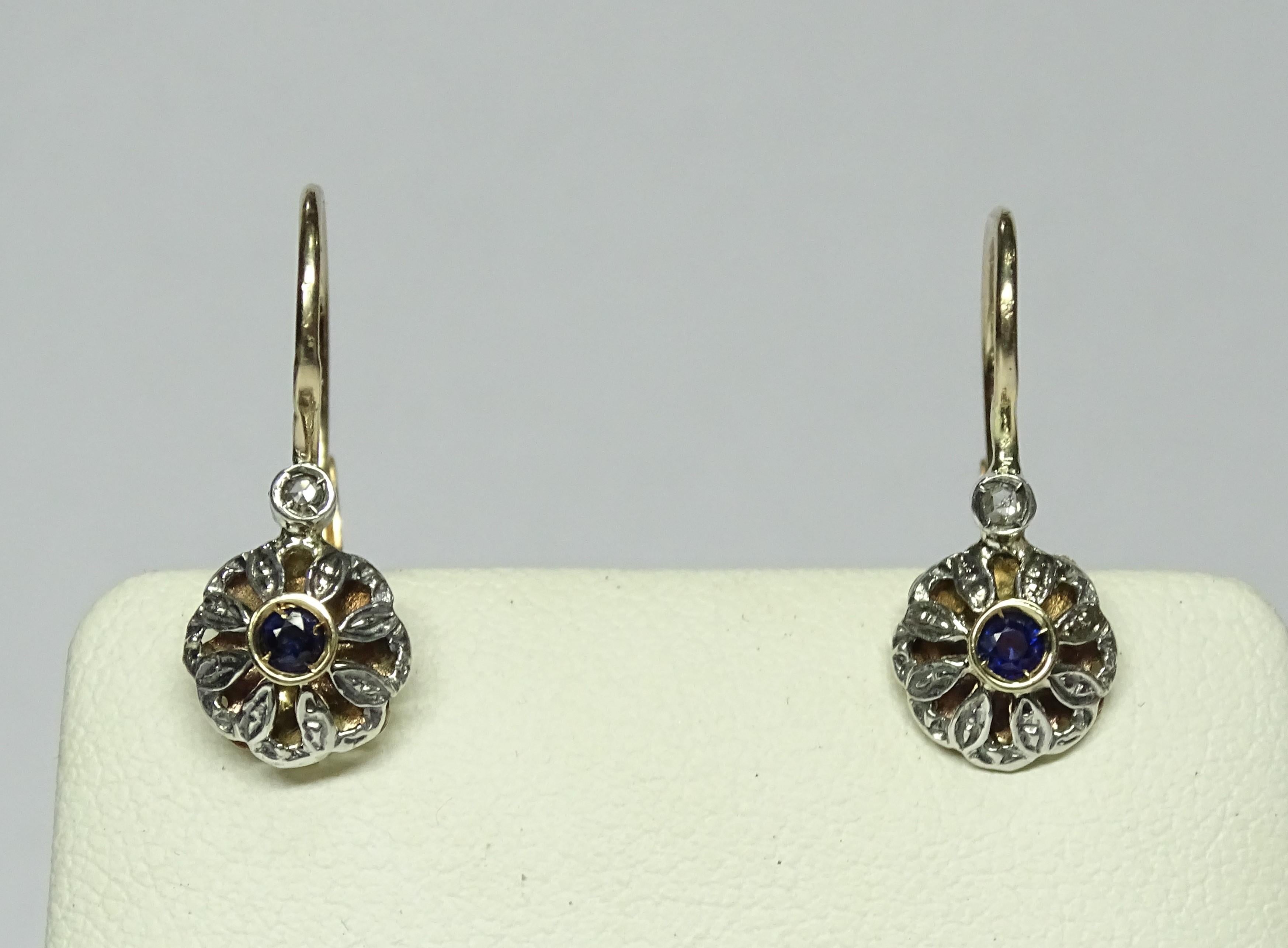 These Earrings are made of 9K Yellow Gold and Sterling Silver.
These Earrings have 0.04 Carats of Rose Cut Diamonds.
These Earrings have 0.18 Carats of Sapphires.
These Earrings are available also with Rubies or Emeralds.
These Earrings are inspired