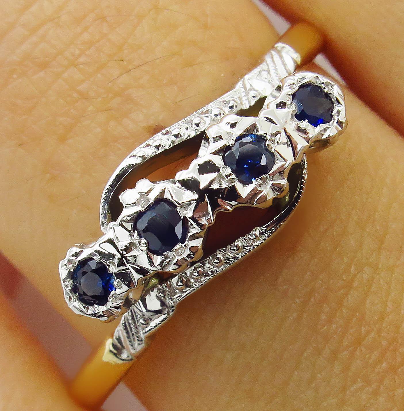 A Timeless Important Antique Victorian 18k Yellow Gold (stamped 18ct) European made Crossover Engagement Ring with 0.18ct total Four Stone Blue Sapphires, set into Platinum Crown.
Classic Solid mounting, finger size 8 1/4, can be re-sized. We offer
