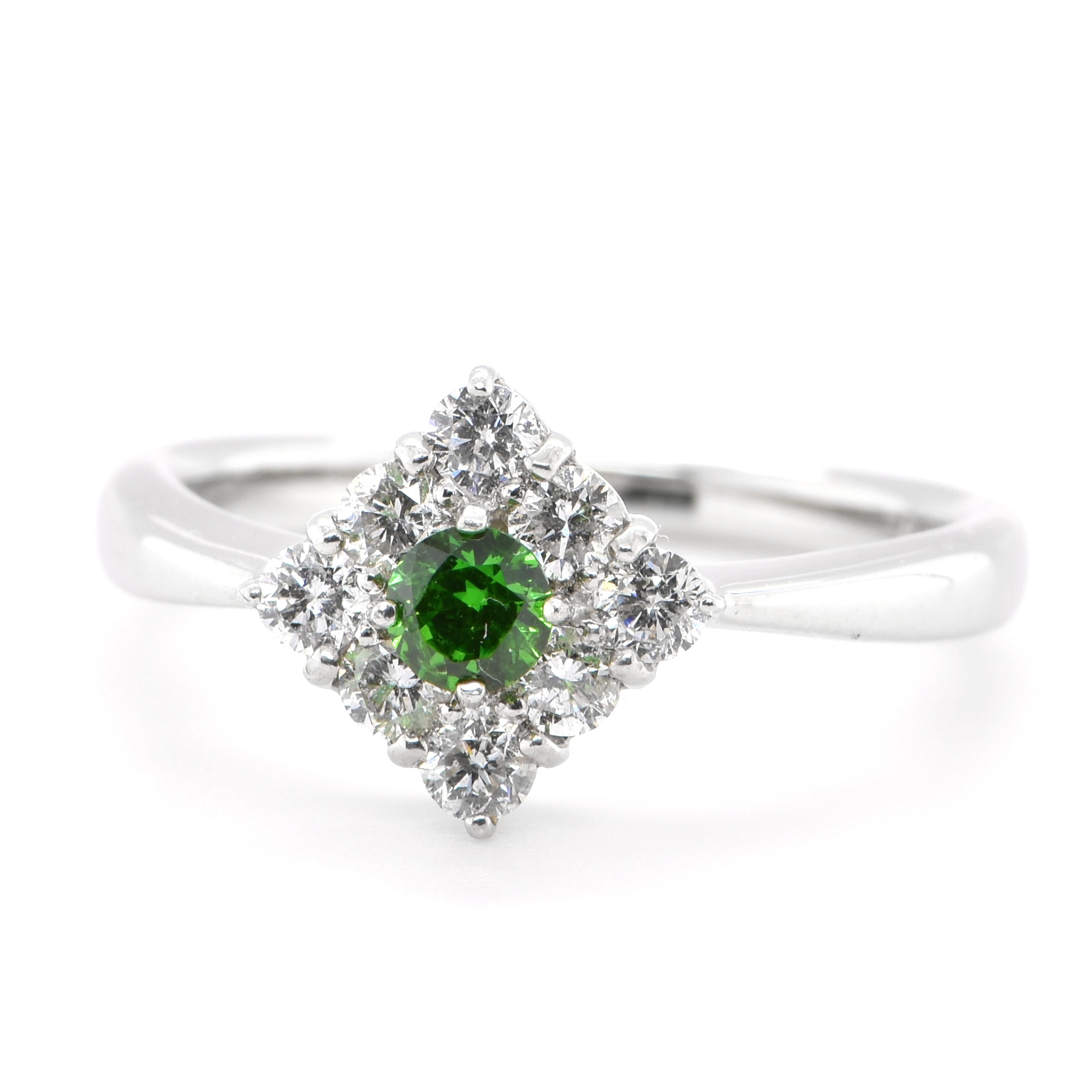 A beautiful cluster ring featuring a 0.19 Carat, Natural Demantoid Garnet and 0.41 Carats of Diamond Accents set in Platinum. Demantoid Garnet's only known source used to be the Ural Mountains in Russia however recent discoveries in Africa have