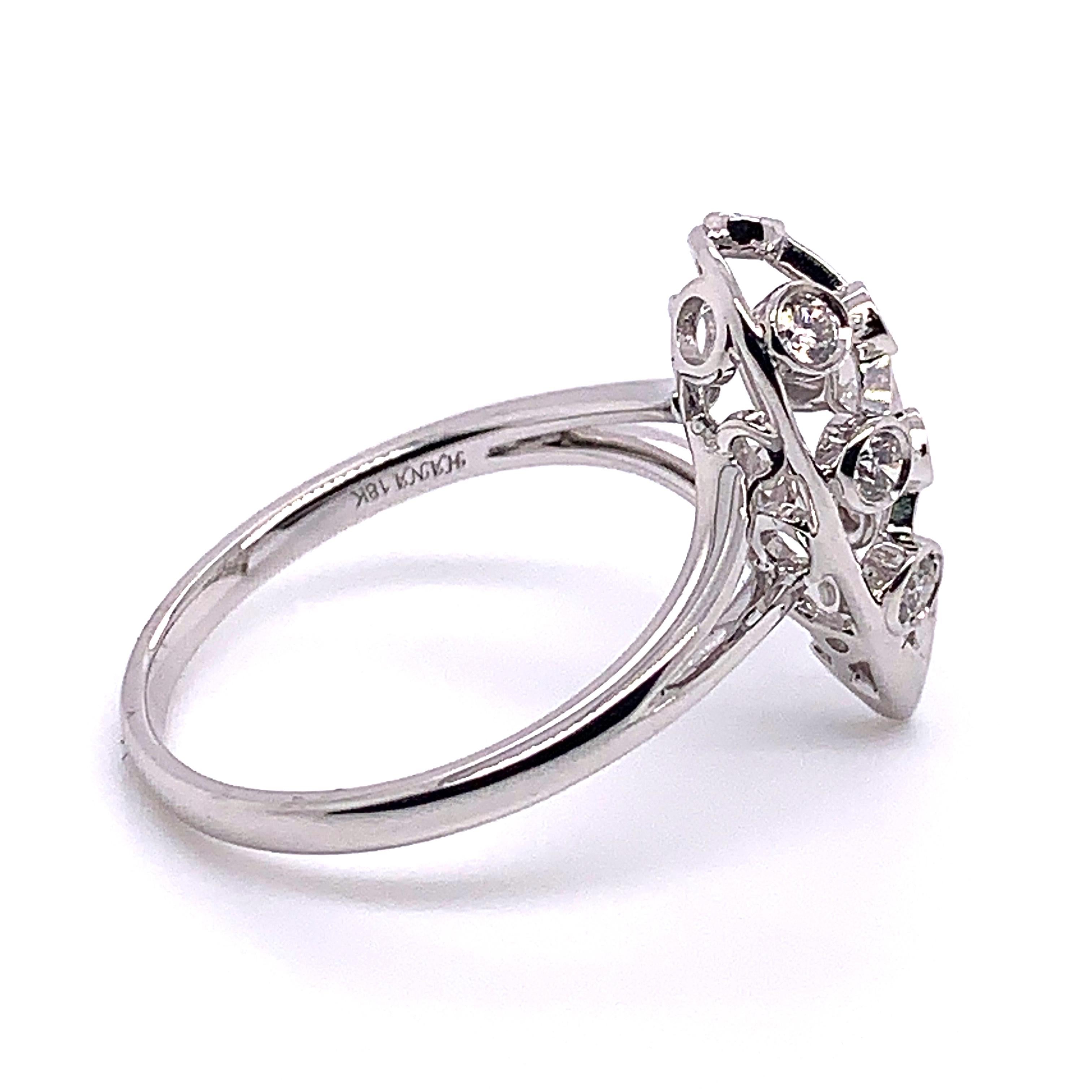 Place this Brightly shining diamond ring on your finger as you can wear it from day into night. This elegant 0.20 carat ring made by Shimon's Creations features 9 round cut white diamonds crafted on 18K white gold.

Diamond And Gold