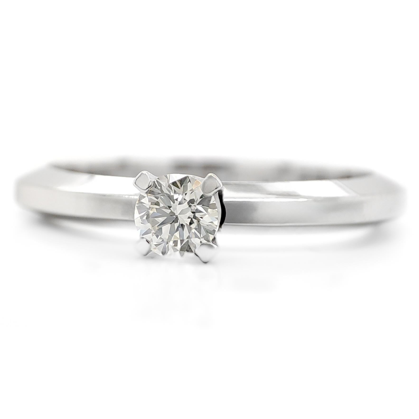 FOR US BUYER NO VAT

This solitaire engagement ring is a timeless symbol of your love and commitment. It features a brilliant 0.20 carat round diamond as its centerpiece, radiating its captivating and enduring sparkle.

The ring is crafted in 14K