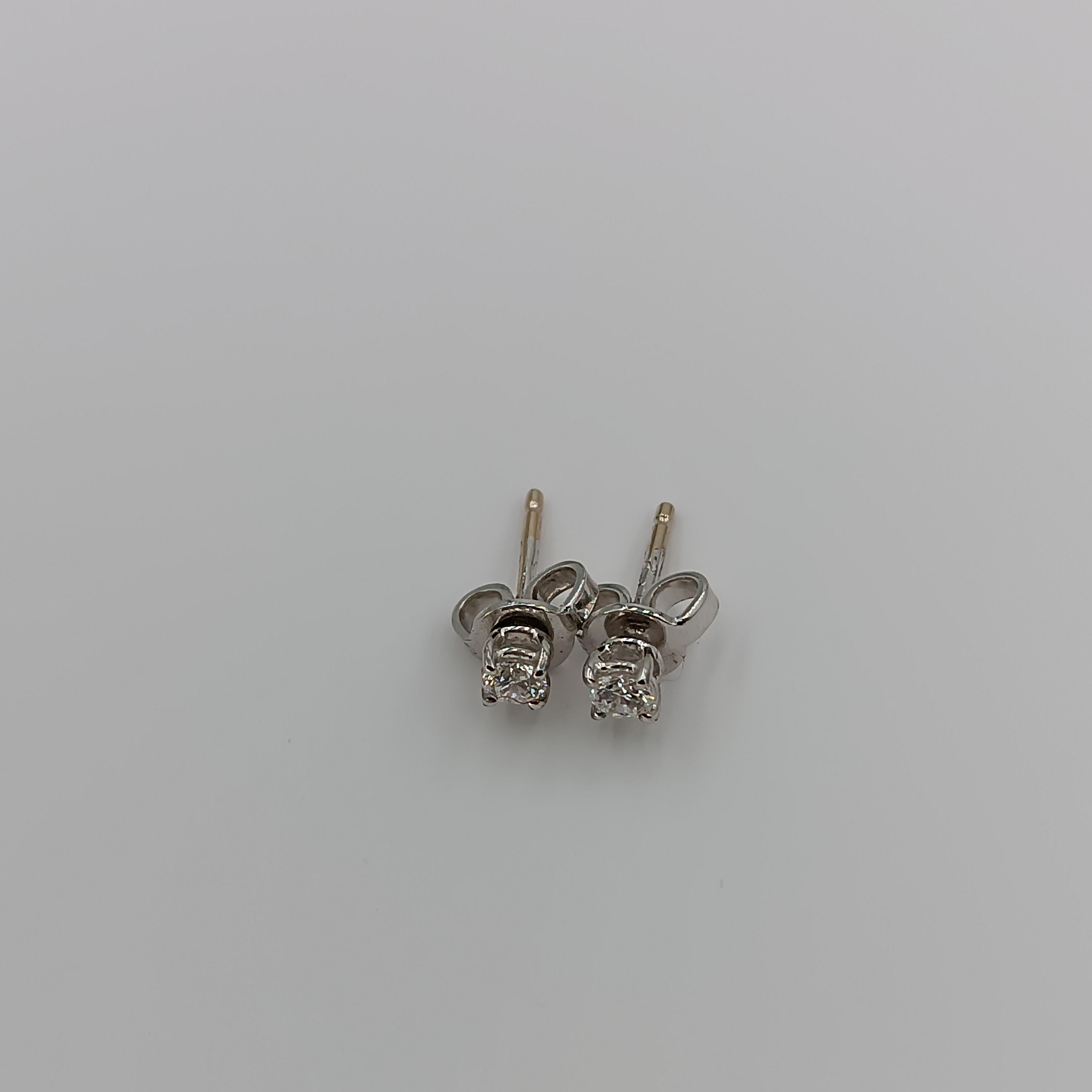 This timeless classic  is all about the round brilliant cut stone, a magnificent 0.20 carat VS G color stone, mounted on a refined 18 carat white gold earring.s grams 1.08
any item of our jewelry collection has a dedicated identification number