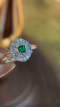 0.20ct Colombian Muzo Emerald Ring with 0.23ct Diamond Halo in PT900 Platinum