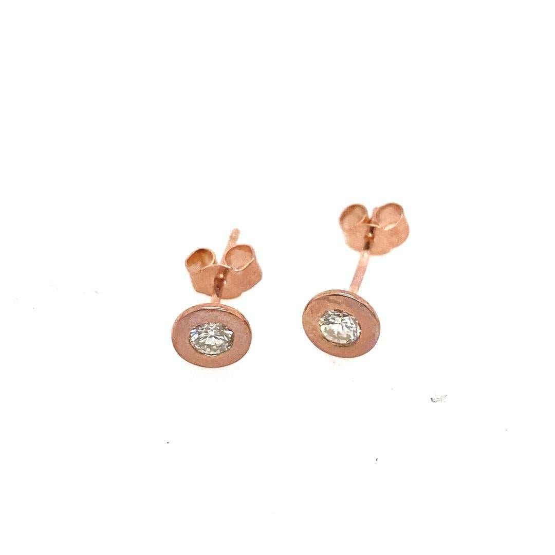 New 18ct Rose Gold Diamond Studs Earrings, In Rubover Setting, 0.20ct of natural Diamonds

Additional Information:
Total Diamond Weight: 0.20ct
Diamond Colour: G/H
Diamond Clarity: SI
Total Weight: 1.4g  
SMS4395
