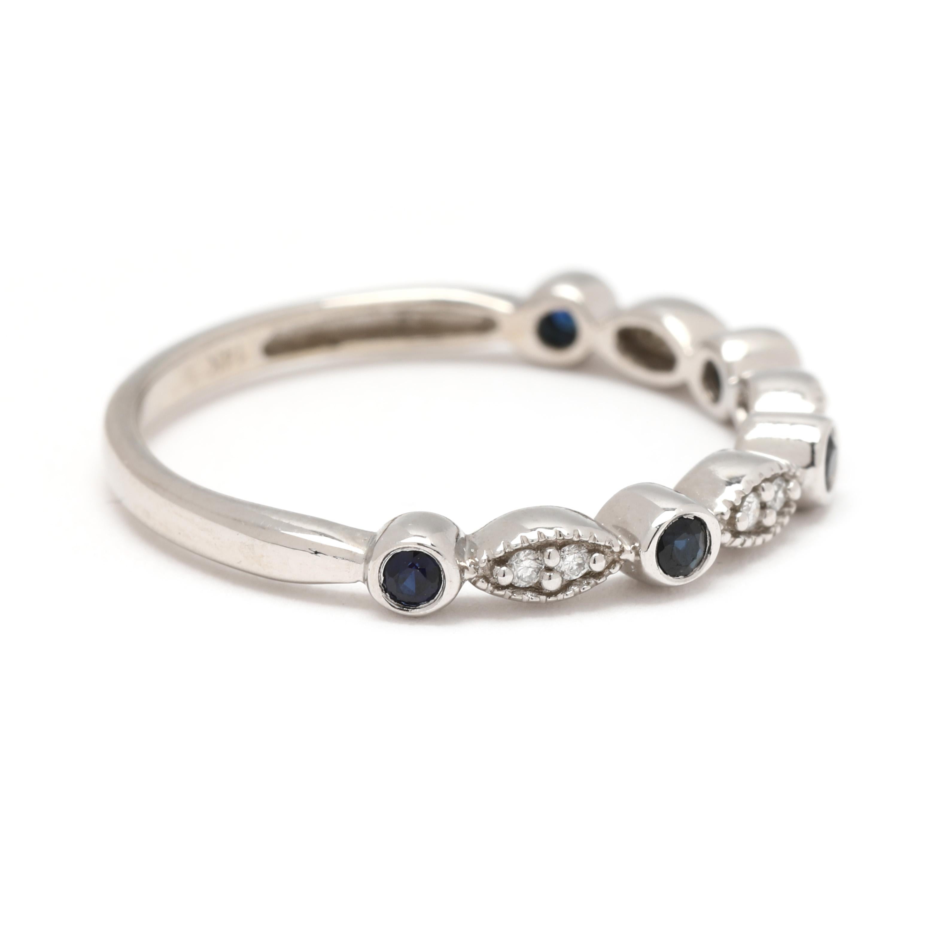Stones:
sapphire, 5 stones
round cut
1.75 mm
approximately .15 total carats
diamond, 8 stones
round brilliant cut
1.1 mm
approximately .05 total carats
HI/SI2-I1

Ring Size 7

Width: 2.8 mm

Weight: 1.2 dwts. / 1.9 grams

Stamps: 
