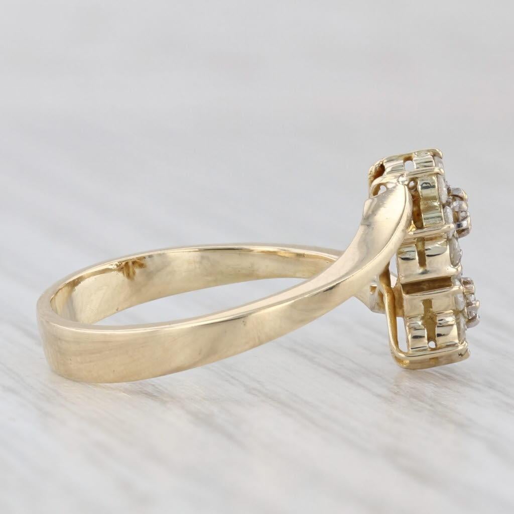Gemstone Information:
- Natural Diamonds -
Total Carats - 0.20ctw
Cut - Round Brilliant
Color - I - J
Clarity - I1 - I2

Metal: 14k Yellow Gold
Weight: 3.6 Grams 
Stamps: 14k
Face Height: 11.9 mm 
Rise Above Finger: 5.3 mm
Band / Shank Width: 3.3