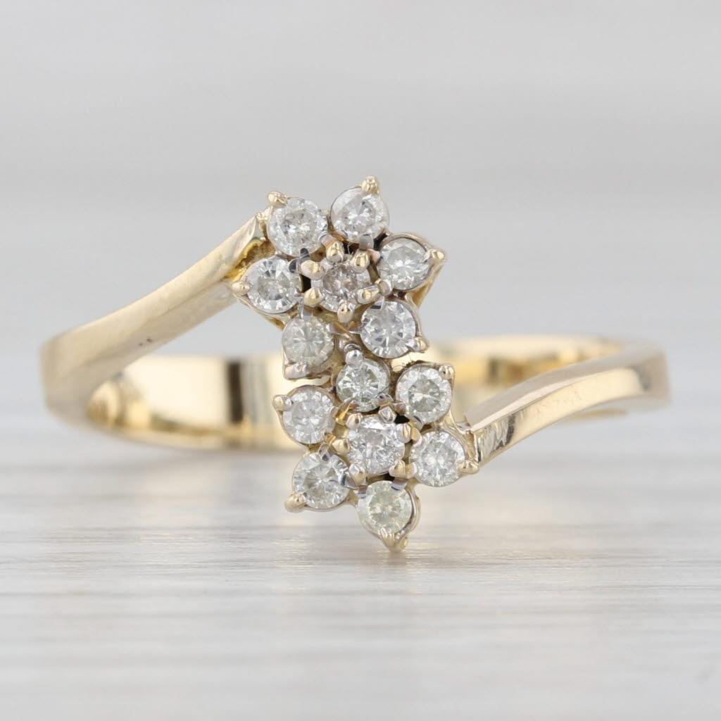 0.20ctw Diamond Flower Cluster Bypass Ring 14k Yellow Gold Size 7.25 In Good Condition For Sale In McLeansville, NC