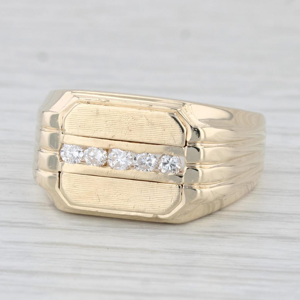 Gemstone Information:
- Natural Diamonds -
Total Carats - 0.20ctw
Cut - Round Brilliant
Color - G - H
Clarity - SI2 - I1

Metal: 14k Yellow Gold
Weight: 9.8 Grams 
Stamps: 14k
Face Height: 11.7 mm 
Rise Above Finger: 4.8 mm
Band / Shank Width: 4.1