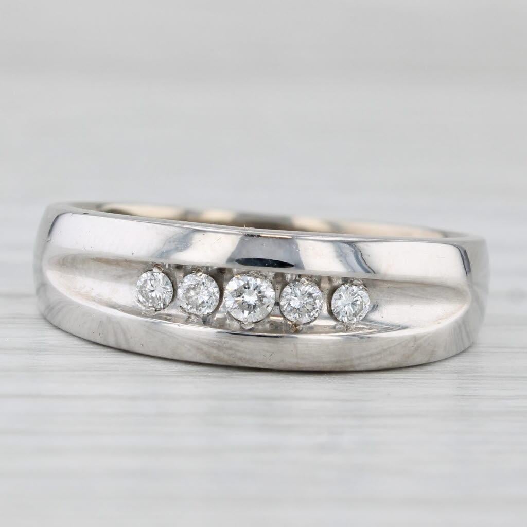 Gemstone Information:
- Natural Diamonds -
Total Carats - 0.20ctw 
Cut - Round Brilliant
Color - I - J
Clarity - SI2 - I1

Metal: 14k White Gold 
Weight: 4.7 Grams 
Stamps: 14k 
Face Height: 7.1mm 
Rise Above Finger: 3.5 mm
Band / Shank Width: 3.2