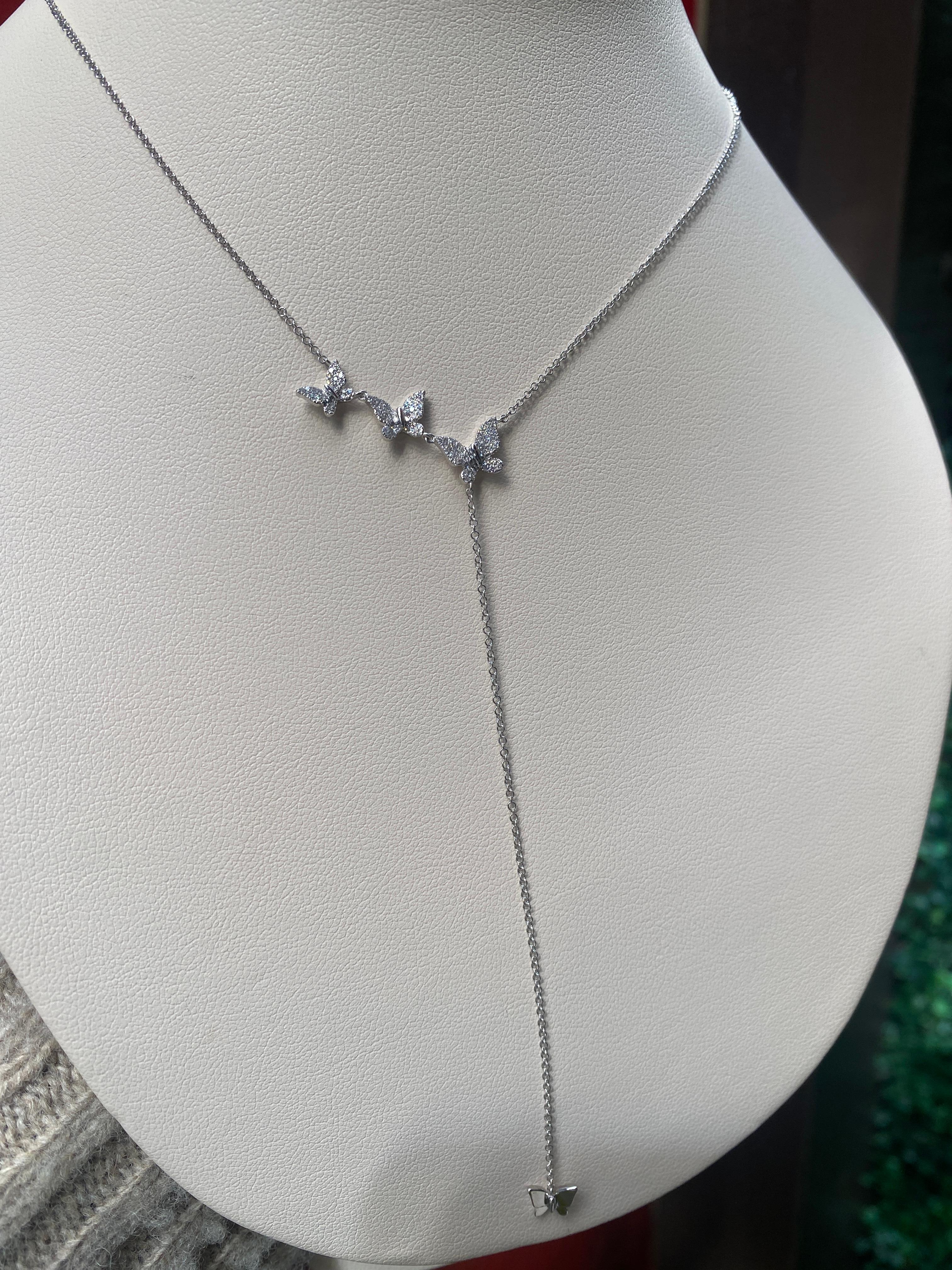 Glänzen Sie mit diesem 14 Karat Weißgold Lariat Stil Halskette, die 3 Pave Diamant Schmetterlinge mit einem Gesamtgewicht von 0,20 mit einem weißen Gold Stern auf dem Lariat. Es ist eine verstellbare 18