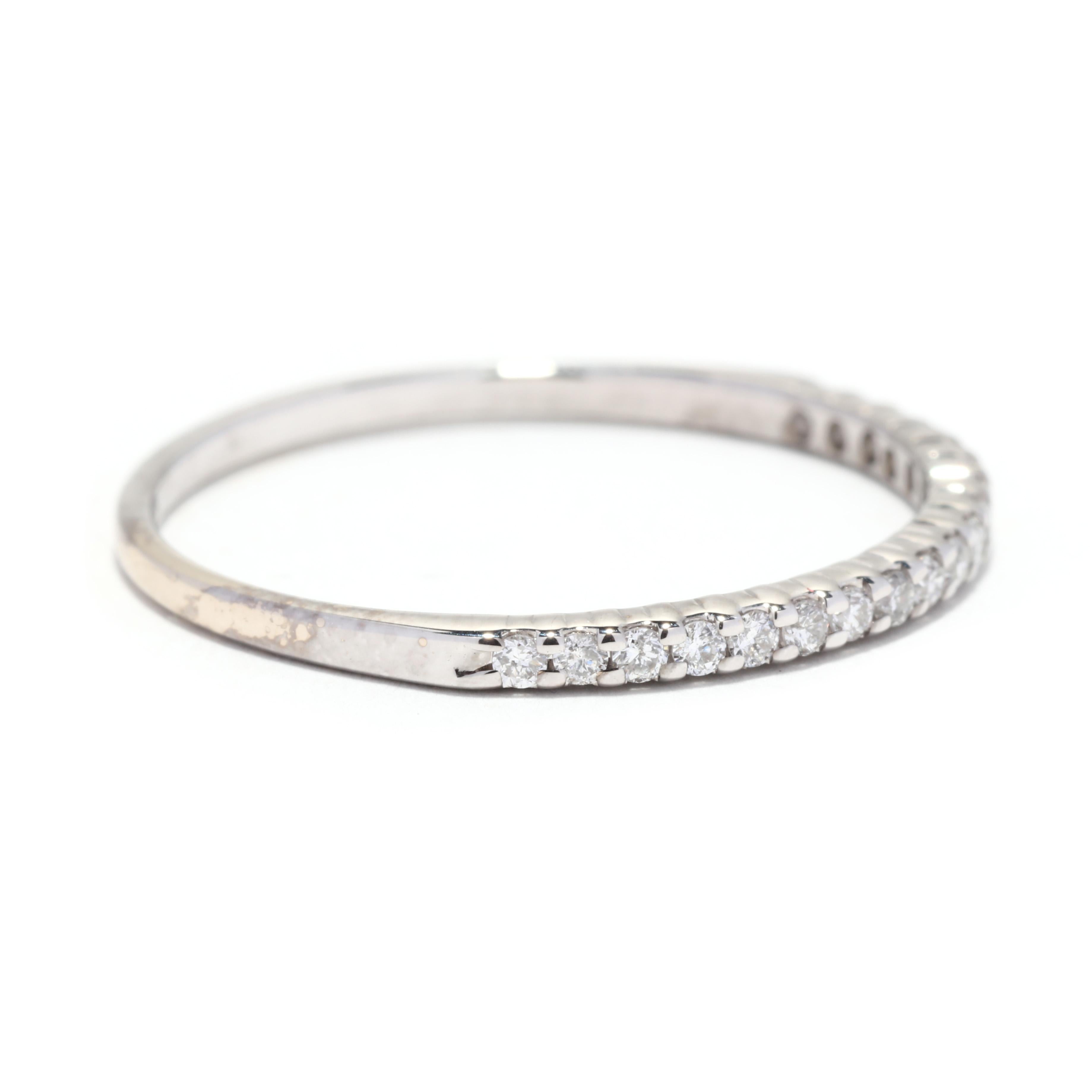 Make a subtle statement with this stunning 0.20ctw diamond wedding band. Crafted in 14K white gold, this delicate ring is perfect for stacking with other rings or wearing alone. The thin ring features 0.20ctw of round brilliant diamonds for a