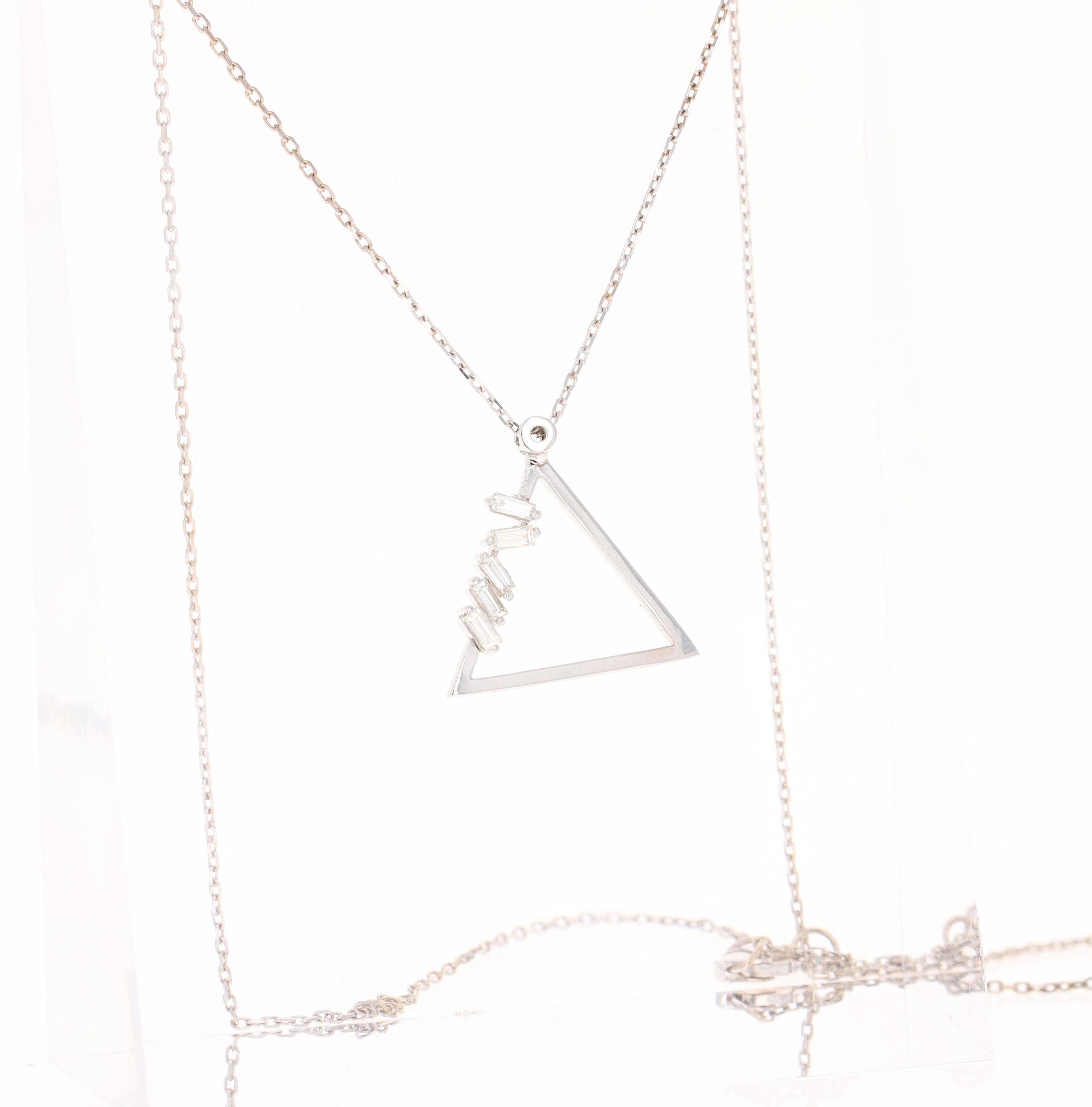 This Chain Necklace has a Triangle Shaped pendant that has 5 Baguette Cut Diamonds that weigh 0.21 carats (Clarity: VS, Color: H) The total carat weight of the Pendant is 0.21 Carats.

It is beautifully curated in 14 Karat White Gold and weighs