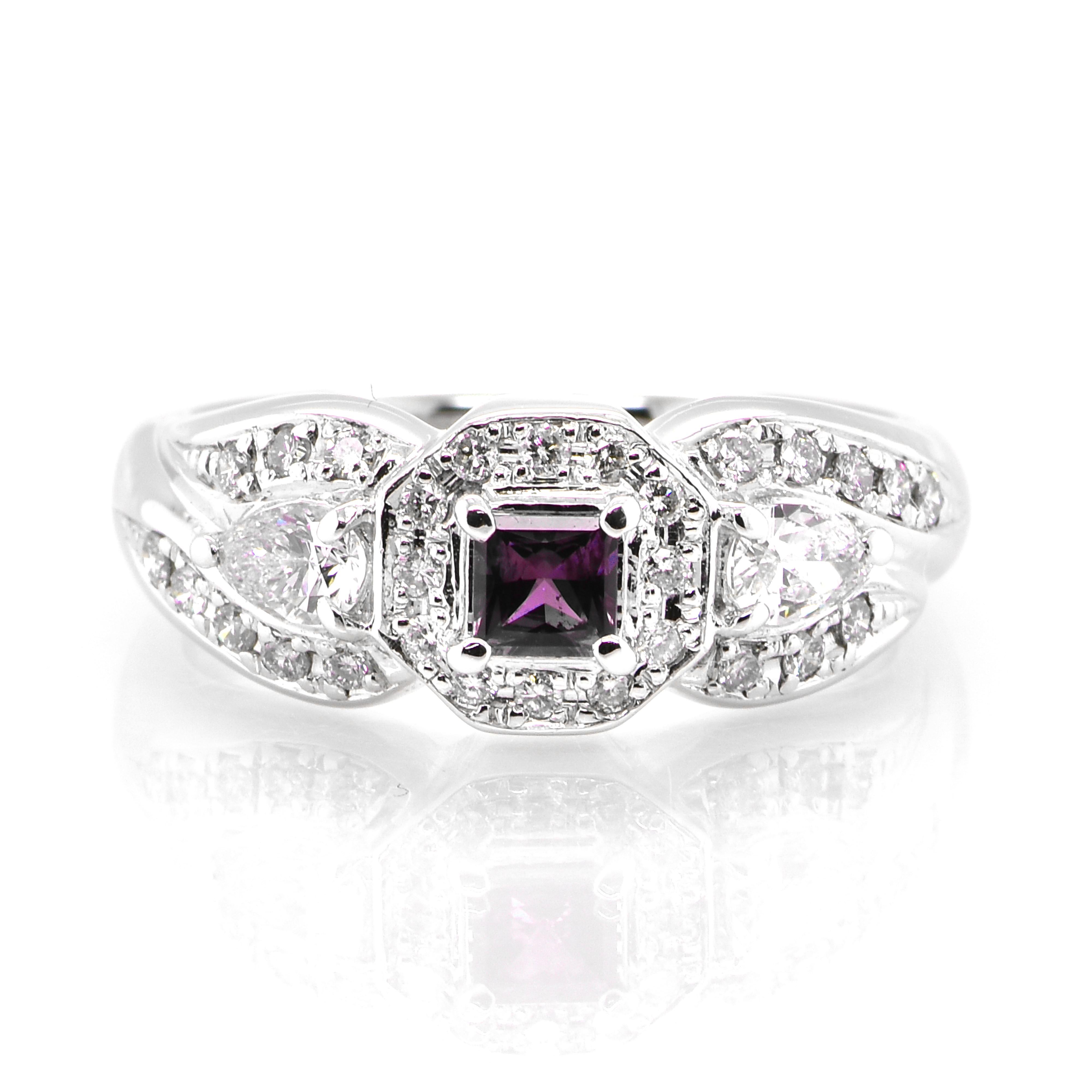 A gorgeous ring featuring 0.21 Carat, Natural Alexandrite and 0.52 Carats of Diamond Accents set in Platinum. Alexandrites produce a natural color-change phenomenon as they exhibit a Bluish Green Color under Fluorescent Light whereas a Purplish Red