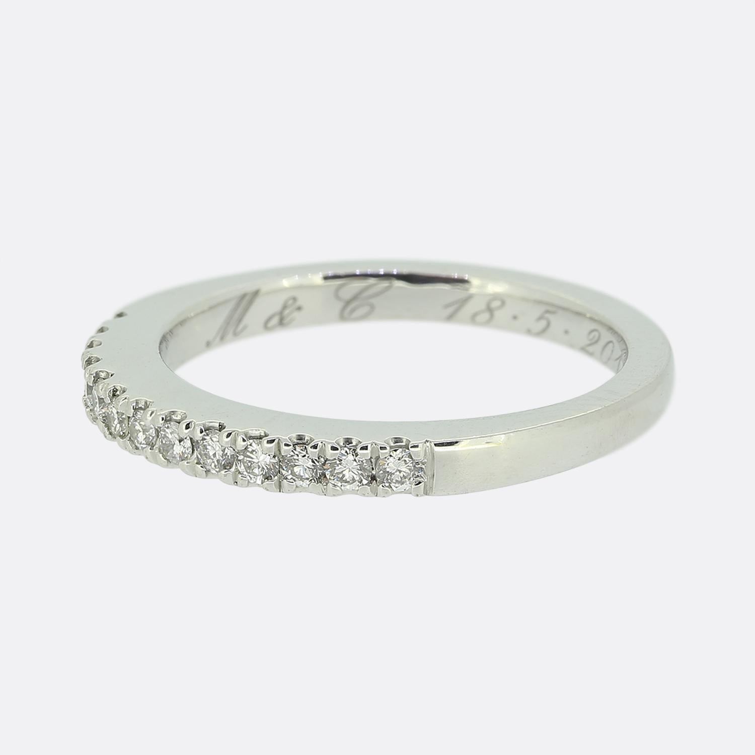 Here we have a classically styled 18ct white gold diamond half-eternity ring. The ring features 13 individually claw set round brilliant cut diamonds in a single line formation across the face whilst the remainder of the shank possesses a plain