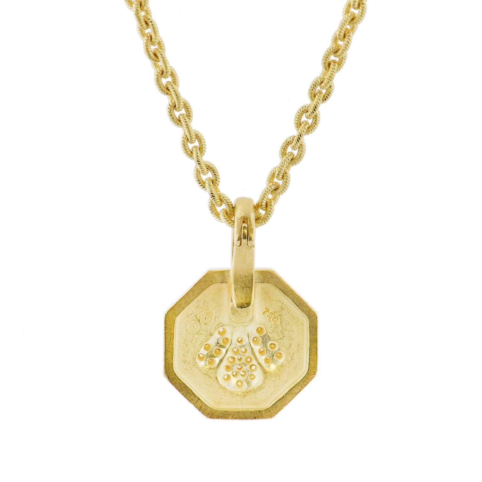 A pendant with spirit, this previously loved Slane octagonal shaped pendant is fashioned in 18 karat yellow gold and features 0.21 carat of pave-set diamond in the shape of a bee (G/H/SI). Strung on an 18 inch chain, this pendant necklace is