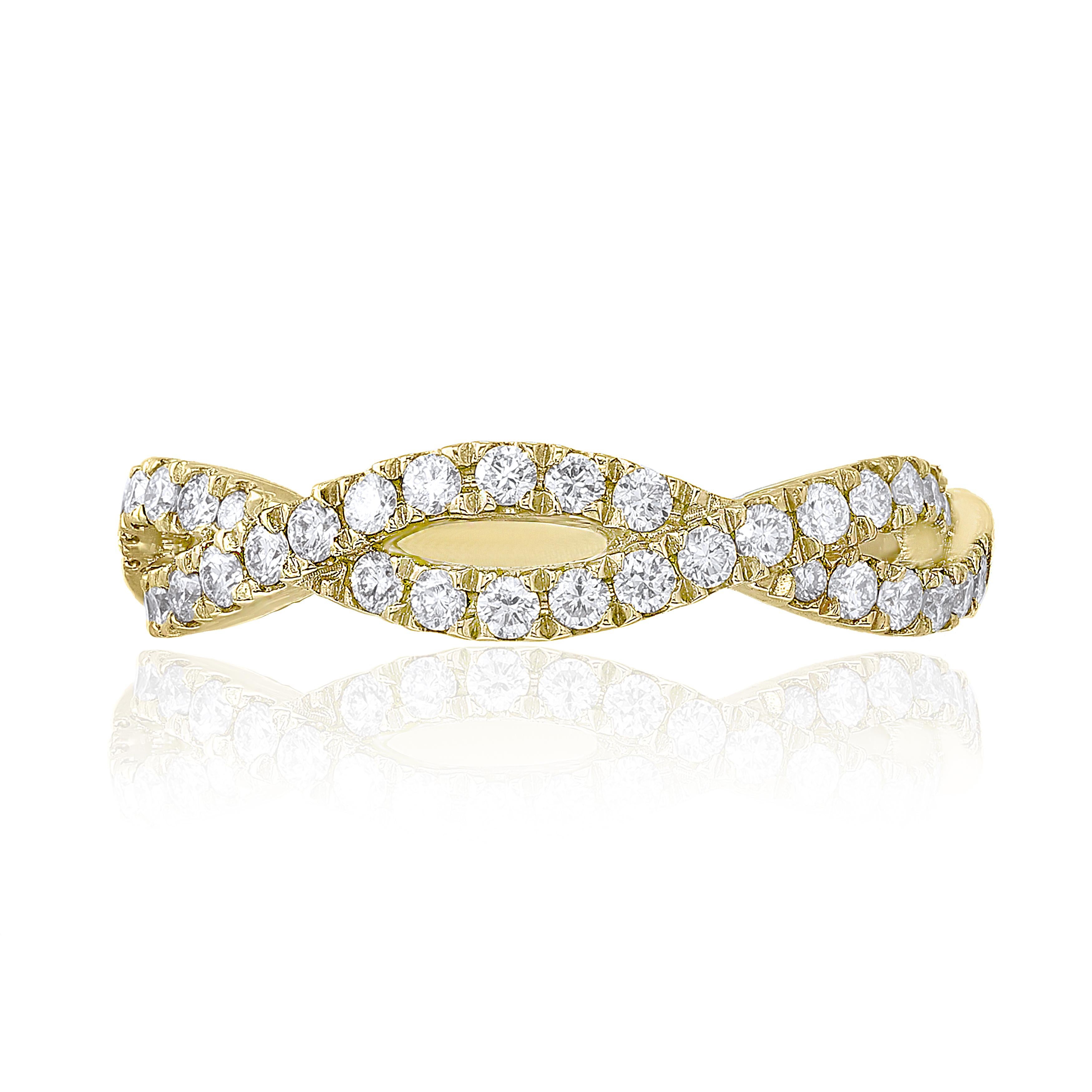 A unique take on the classic diamond wedding rings. Features 0.21 carat round diamonds set in 18k yellow gold. Two lines of sparkling diamonds intertwine to symbolize the infinite love between two people. 
Size 6.5 US (Sizable). One of a Kind 