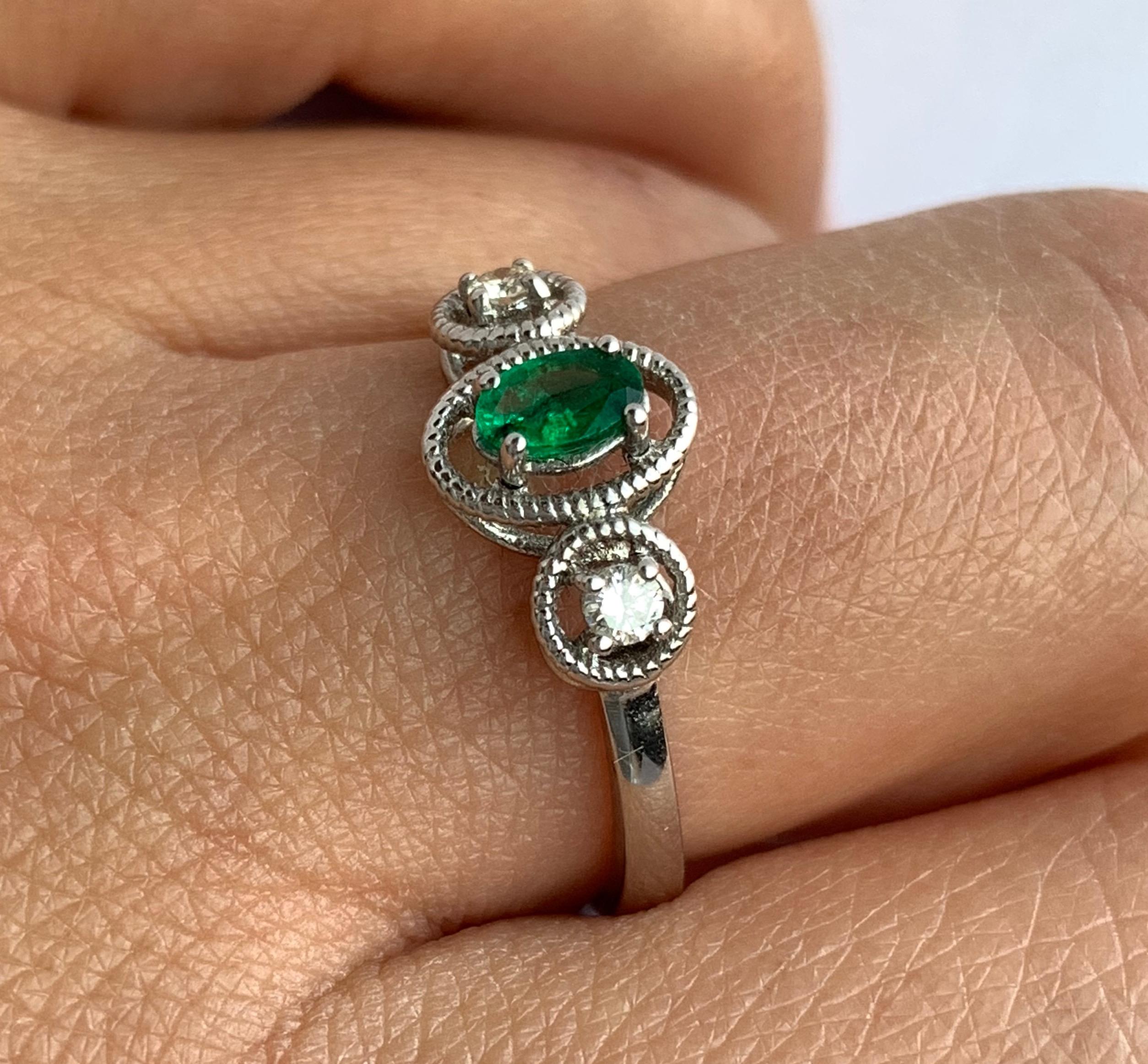 Contemporary 0.21 Carat Oval Emerald and Diamond Ring