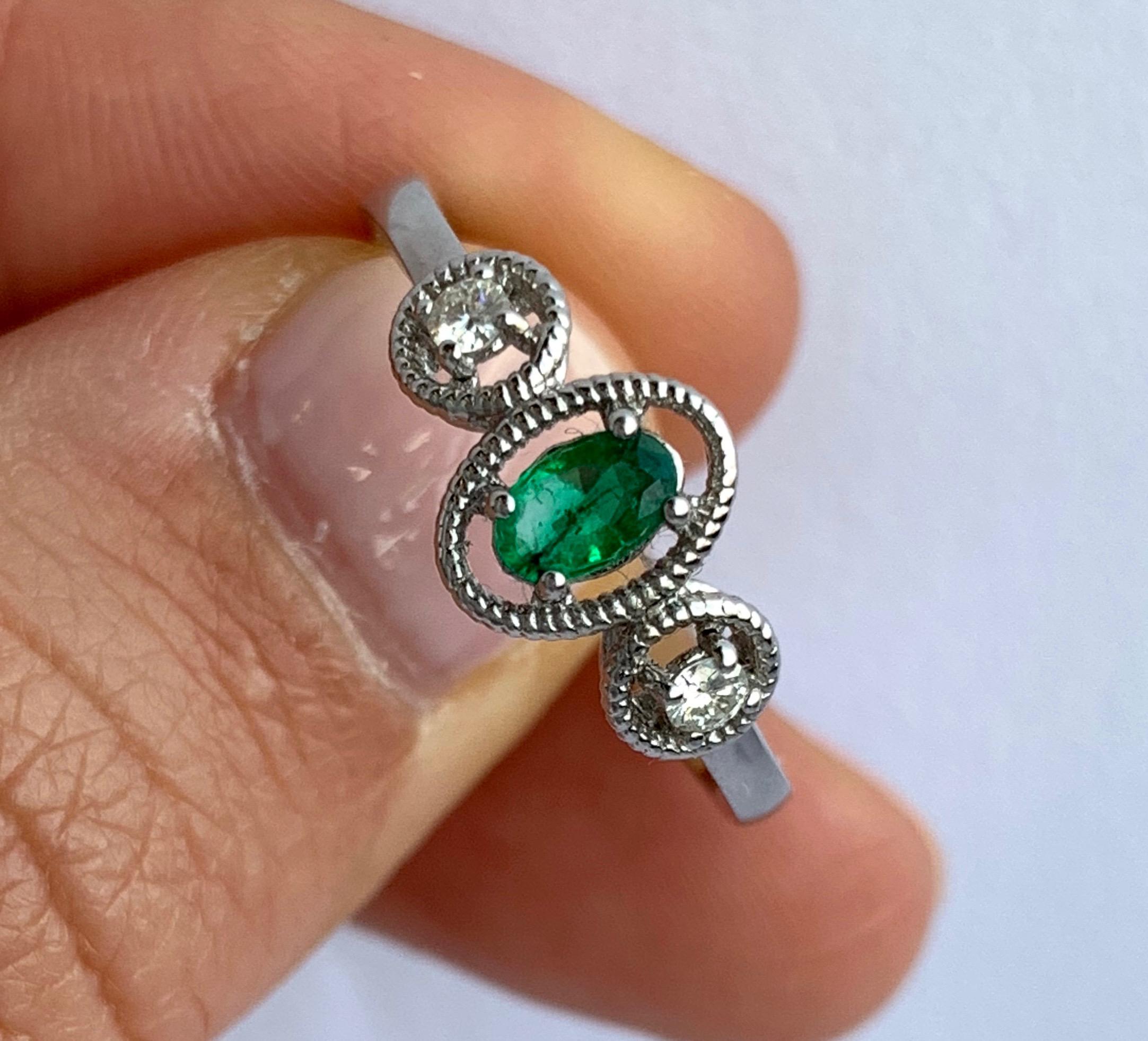 Oval Cut 0.21 Carat Oval Emerald and Diamond Ring
