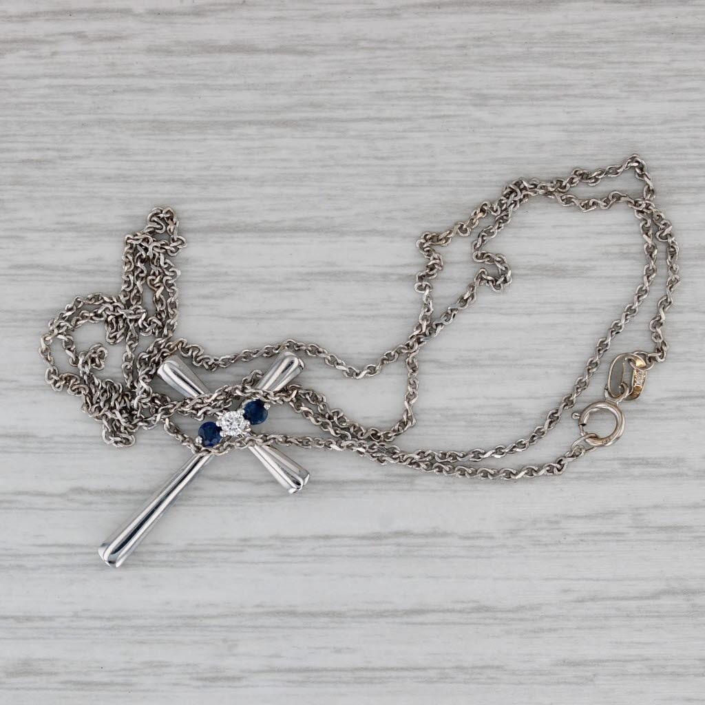 Gemstone Information:
- Natural Sapphire -
Carats - 0.15ct
Cut - Round
Color - Dark Blue
Treatment - Heated

- Natural Diamonds -
Total Carats - 0.06ctw
Cut - Round Brilliant
Color - H - I
Clarity - I1

Metal: 14k White Gold
Weight: 4.4 Grams