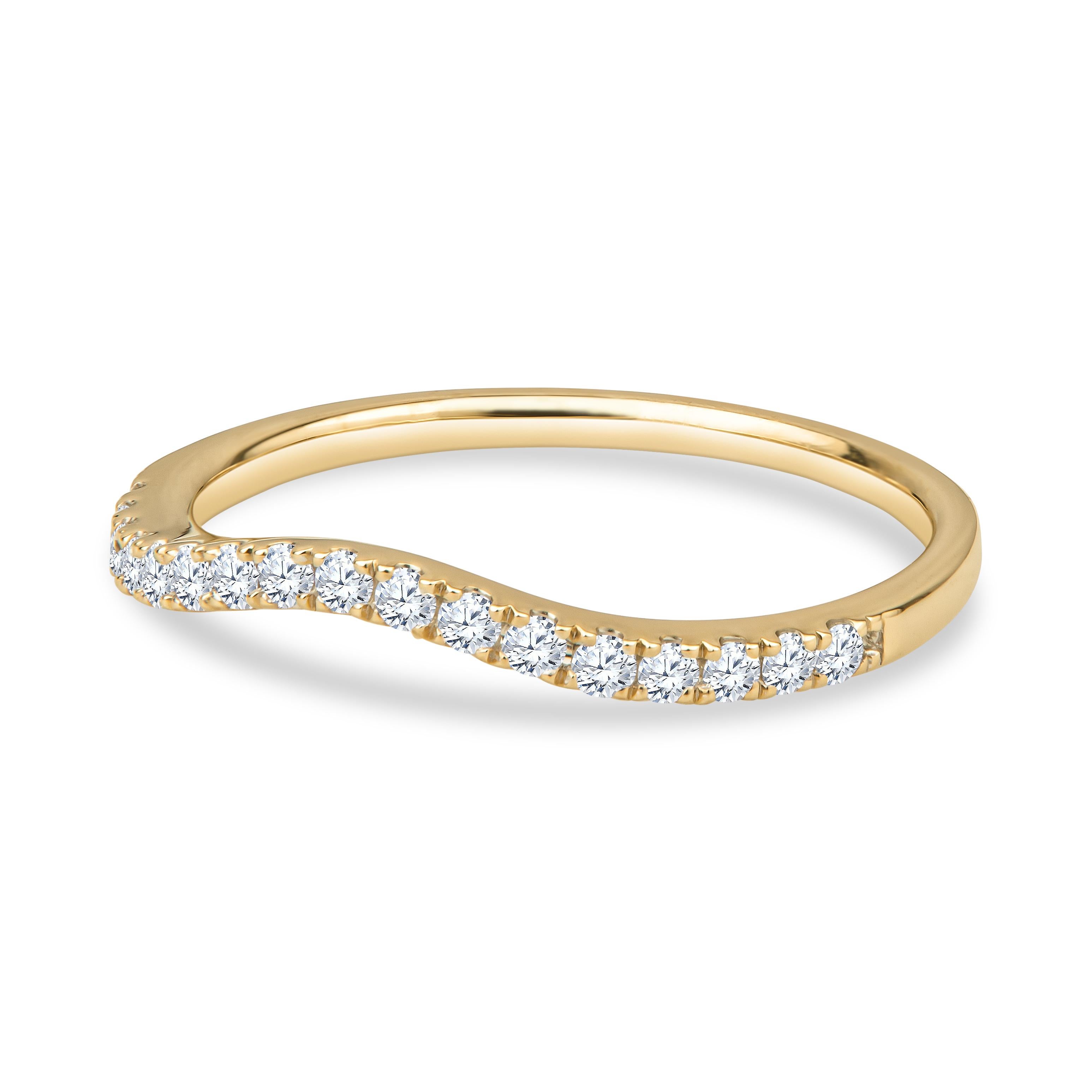 This beautiful, simple curved band adds just enough flair while still keeping it subtle. The ring is made of 18kt yellow gold and features 0.21ctw in round brilliant diamonds. It is currently a size 6.5, but may be resized to be smaller or larger