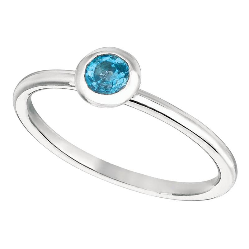 En vente :  Bague en or blanc 14 carats sertie d'une topaze bleue de 0,22 carat et d'une monture chaton