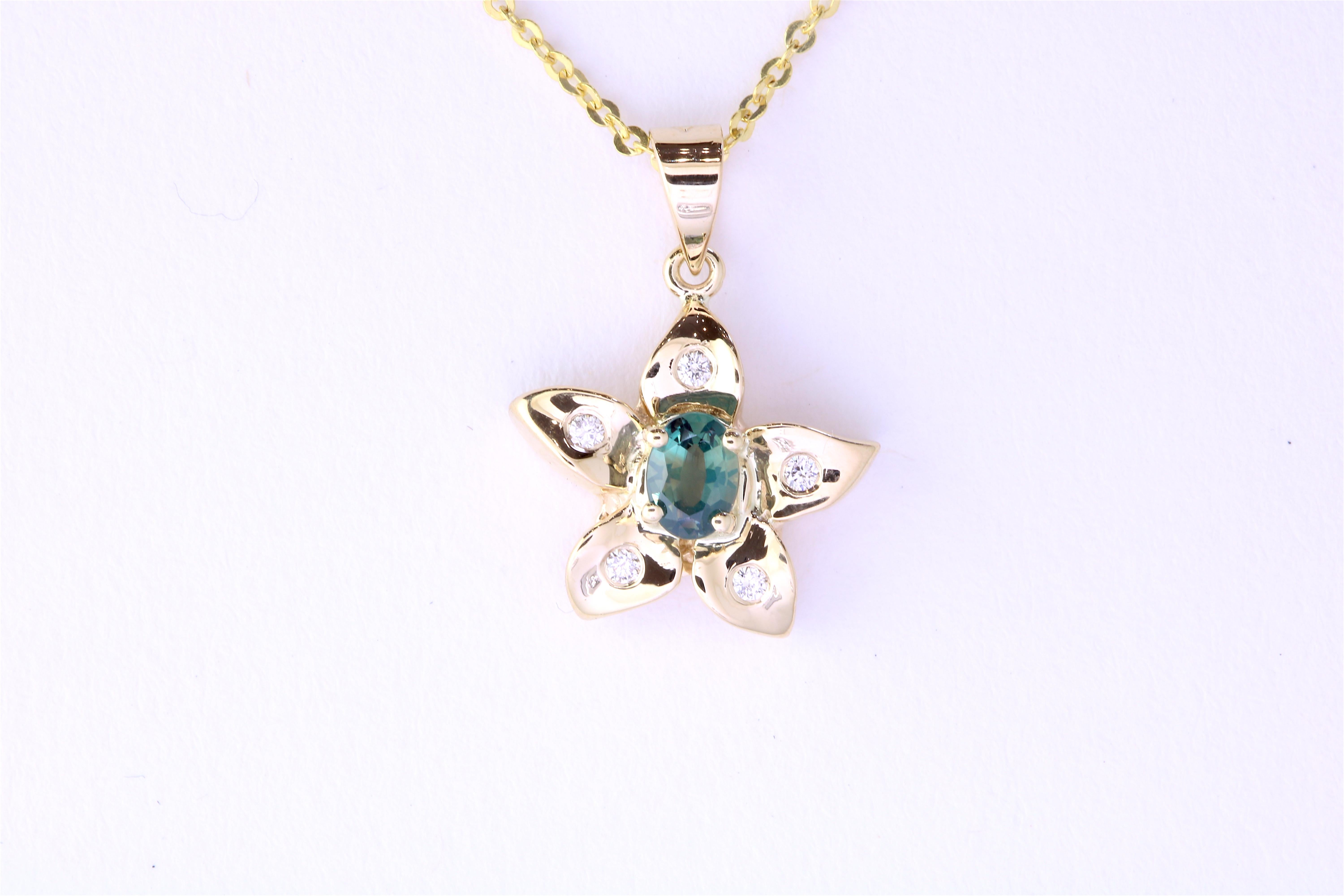 Material: 14k Yellow Gold 
Center Stone Details: 0.22 Carat Oval Natural Color Changing Alexandrite - 4.5 x 3.4 mm
Mounting Diamond Details: 5 Round White Diamonds Approximately 0.03 Carats - Clarity: SI / Color: H-I
Chain: 18 inch

Match this with