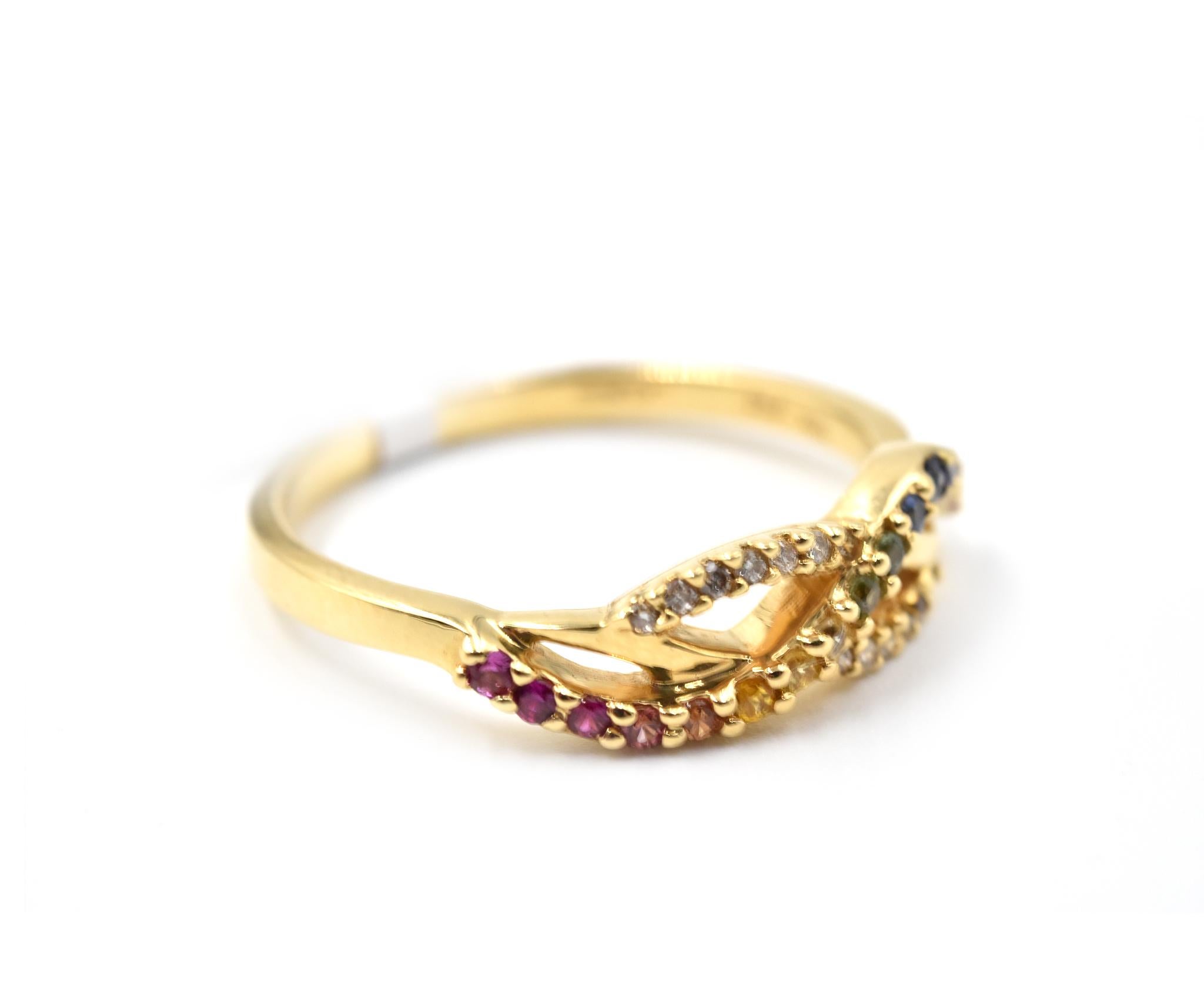 Designer: custom design
Material: 14k yellow gold
Rainbow Sapphires: round cut 0.22 carat weight 
Diamonds: round brilliant cut 0.06 carat weight
Ring Size: 8 1/2 (please allow two additional shipping days for sizing requests)
Weight: 3.46 grams
