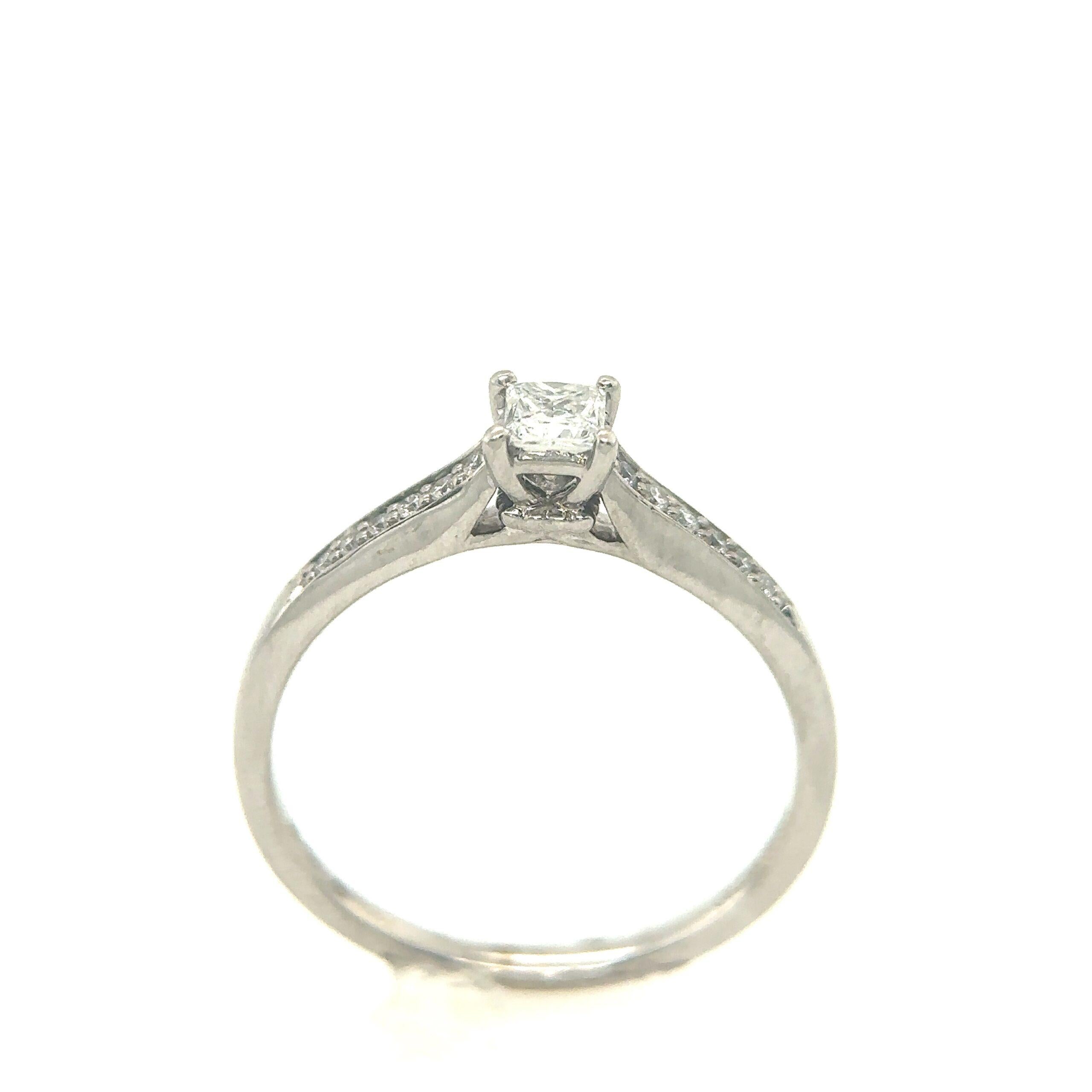 9ct white gold solitaire diamond engagement ring, with 0.22ct centre stone, and 0.06ct of diamonds on the shoulders.

Additional Information:
Total Diamond Weight: 0.22ct + 0.06ct
Diamond Colour: G/H
Diamond Clarity: SI
Total Weight: 2.3g
Width Of