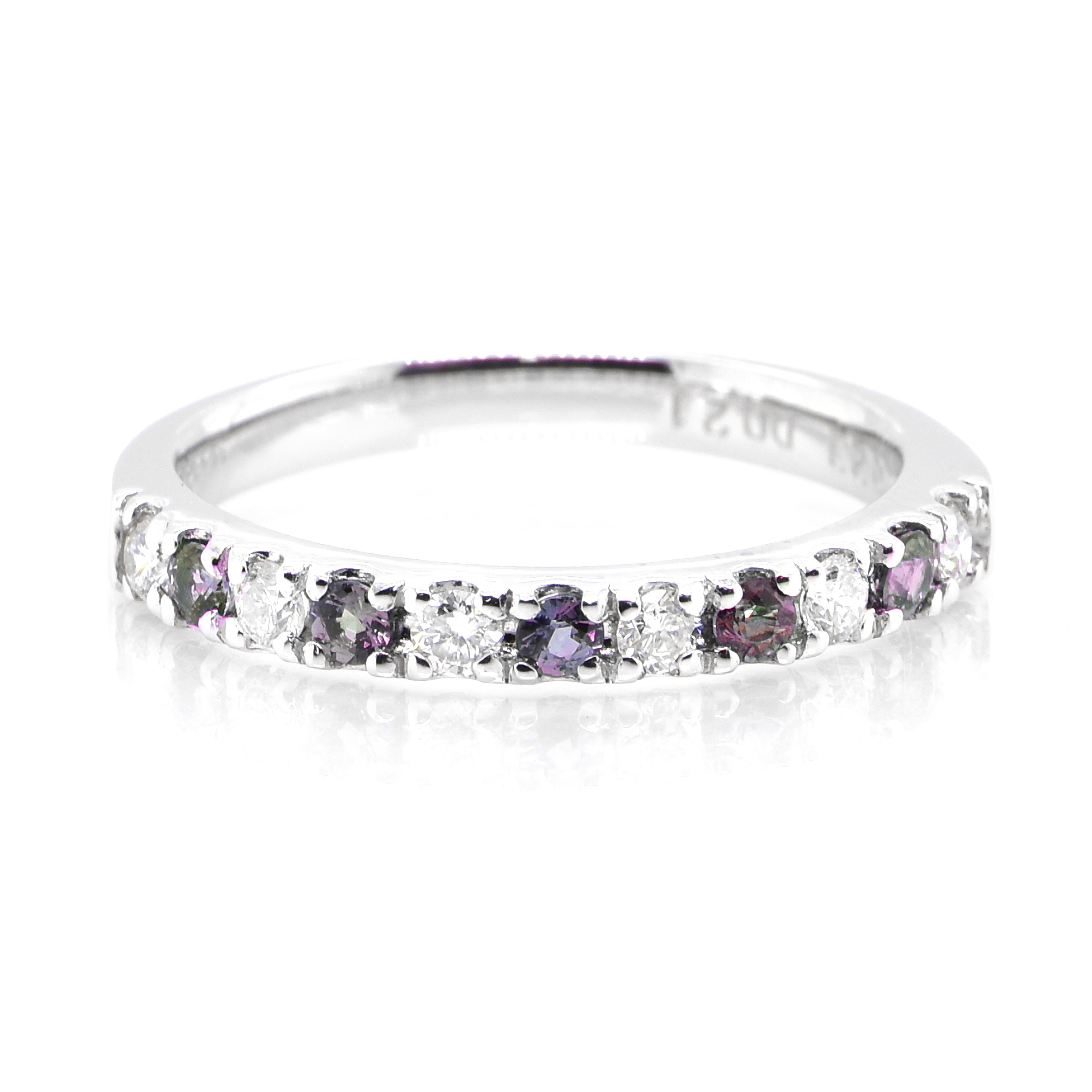 A gorgeous ring featuring 0.23 Carat, Natural Alexandrite and 0.21 Carats of Diamond Accents set in Platinum. Alexandrites produce a natural color-change phenomenon as they exhibit a Bluish Green Color under Fluorescent Light whereas a Purplish Red