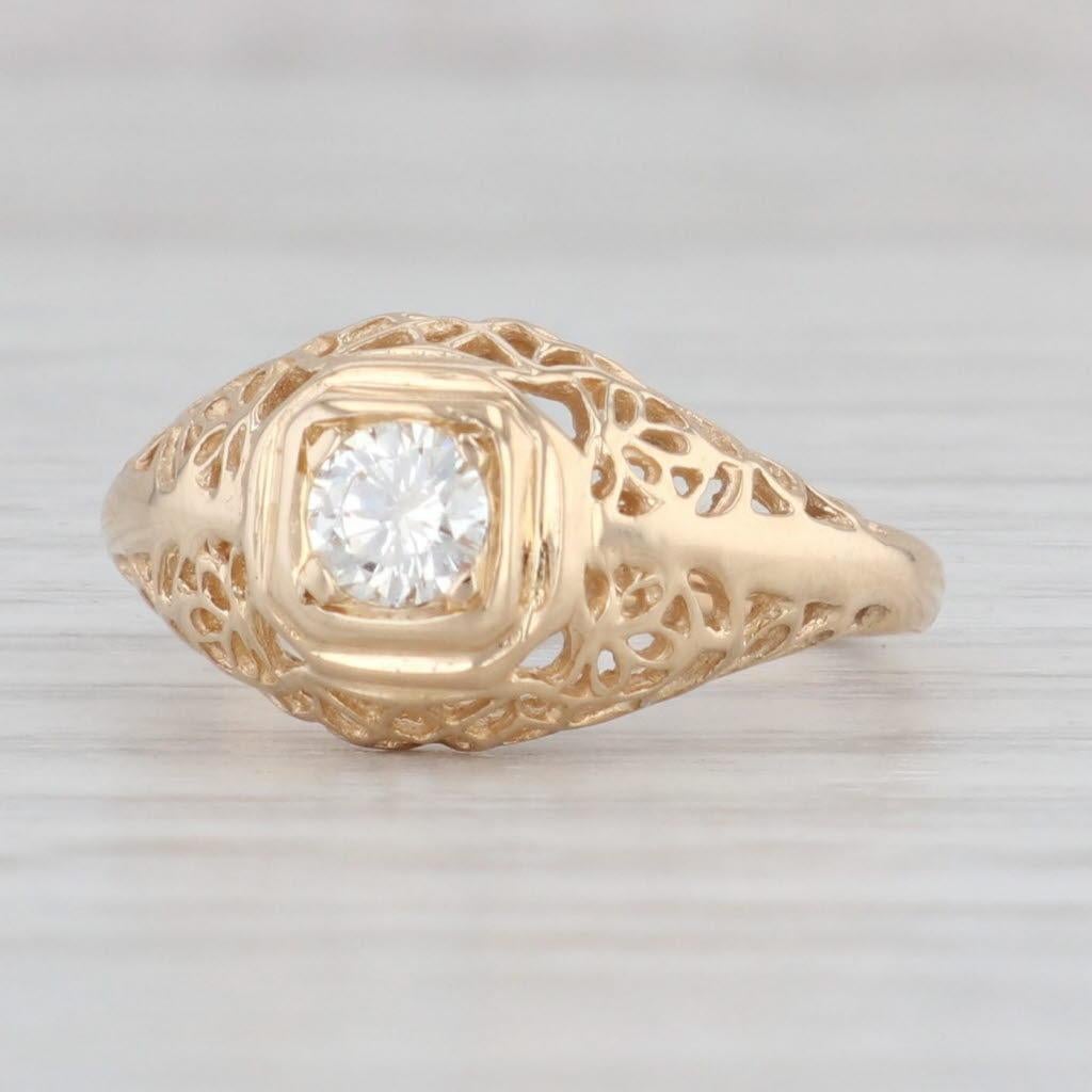 Gemstone Information:
- Natural Diamond -
Carats - 0.23ct 
Cut - Round Brilliant
Color - G - H
Clarity - SI1

Metal: 14k Yellow Gold
Weight: 2.6 Grams 
Stamps: 14k
Face Height: 9.6 mm 
Rise Above Finger: 5.8 mm
Band / Shank Width: 2 mm

This ring is