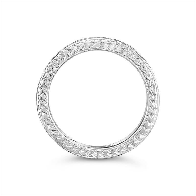 This platinum detailed anniversary band features 0.23 carat total weight in round brilliant channel set diamonds halfway down the shank and is finished with wheat hand engraving on the profile and sides all the way around the band. This ring is a