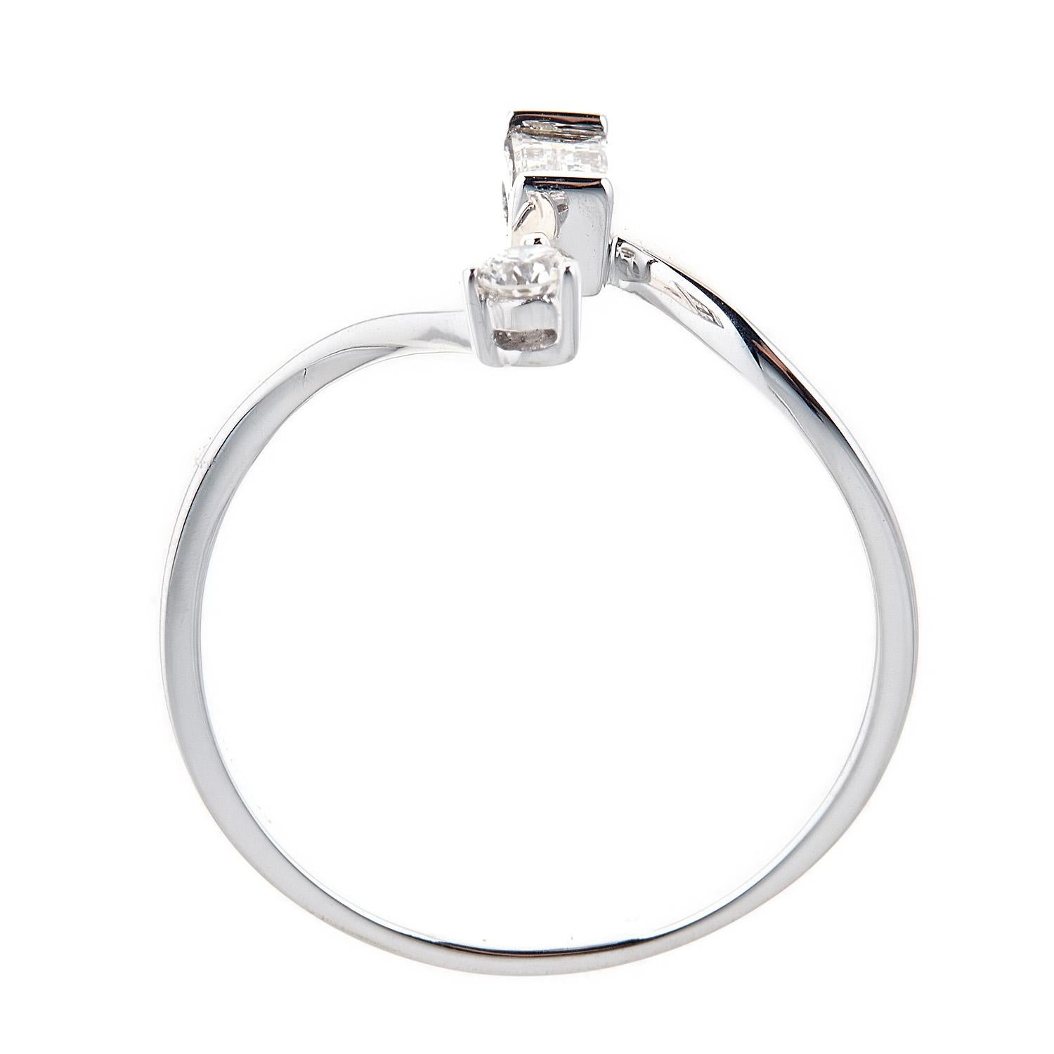 Featuring our Gin and Grace Diamond ring crafted of 14k white gold, this jewelry is the ideal way to showcase your bold style. 
This ring features an 1  Baguette Diamond 0.17 carat and 1 Round glistening diamond in GH SI quality 0.07 carat with a