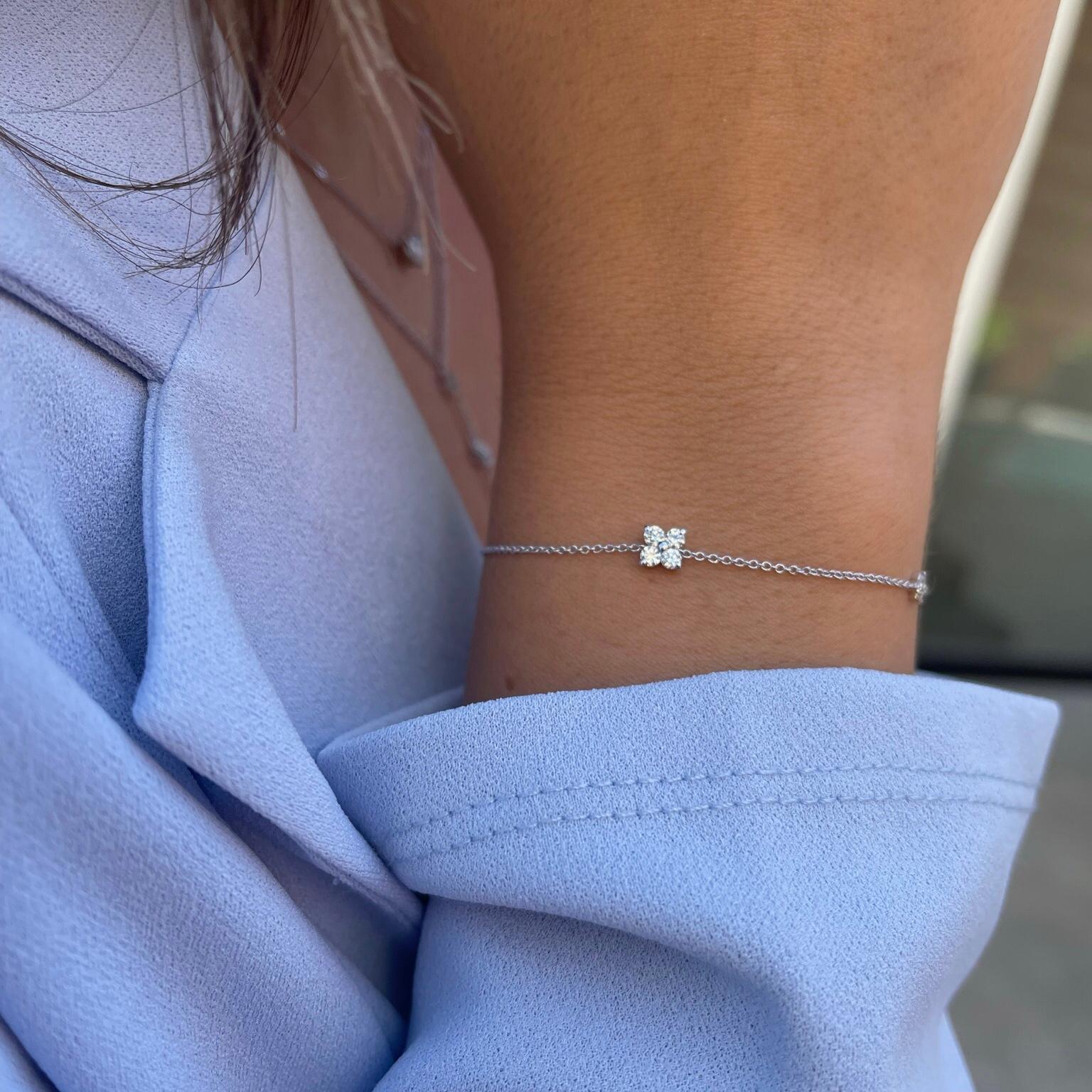 0.24 Carat Diamond Flower Petal Bracelet in 14 Karat White Gold, Shlomit Rogel

Beautiful sparkle meets a wonderfully elegant design in this dainty chain bracelet. Crafted from 14k solid white gold, the bracelet features a diamond flower at the