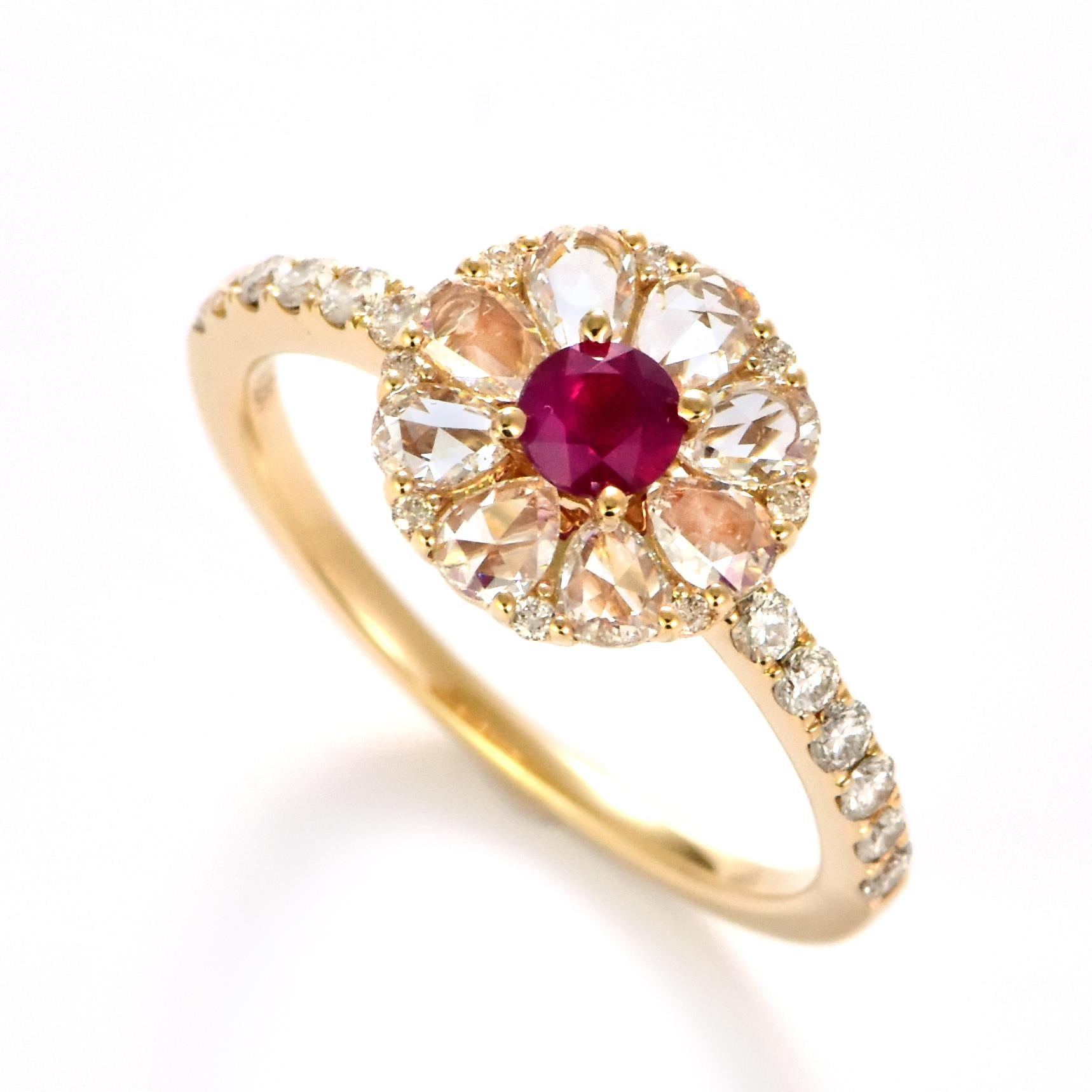 Magnifique bague en or 18 carats ornée d'un rubis naturel de 0,24 carat et de diamants taillés en rose de 0,80 carat. Les rubis sont appelés 